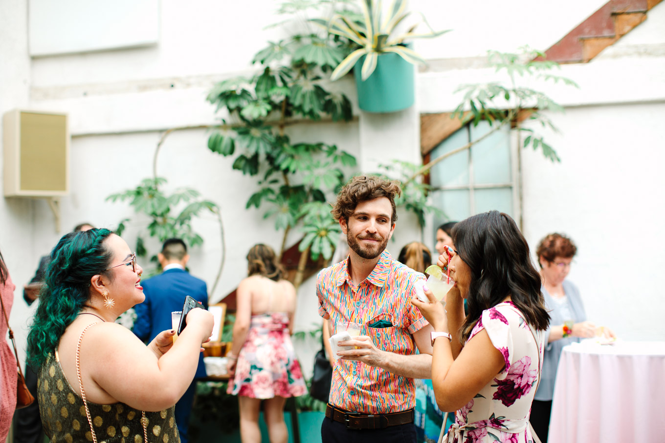 Guests enjoying cocktail hour | Colorful Downtown Los Angeles Valentine Wedding | Los Angeles wedding photographer | #losangeleswedding #colorfulwedding #DTLA #valentinedtla   Source: Mary Costa Photography | Los Angeles