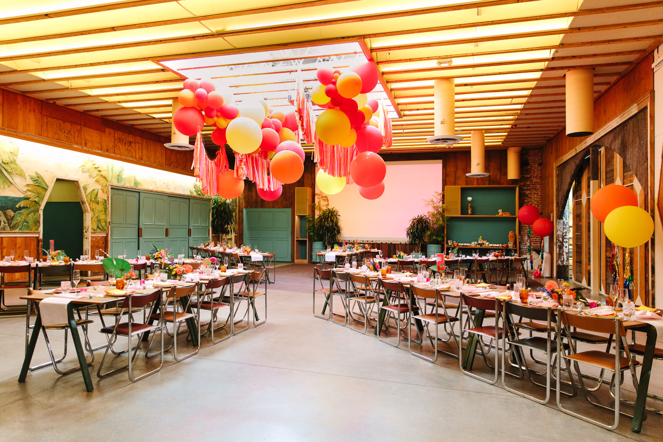 Colorful wedding reception with streamers balloons and bright flowers | Colorful Downtown Los Angeles Valentine Wedding | Los Angeles wedding photographer | #losangeleswedding #colorfulwedding #DTLA #valentinedtla   Source: Mary Costa Photography | Los Angeles