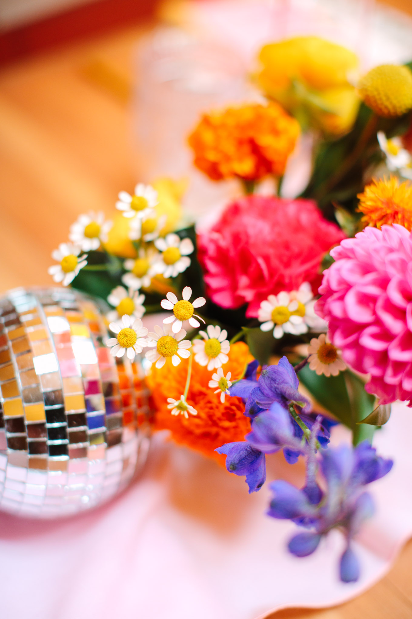 Disco ball and florals at wedding reception | Colorful Downtown Los Angeles Valentine Wedding | Los Angeles wedding photographer | #losangeleswedding #colorfulwedding #DTLA #valentinedtla   Source: Mary Costa Photography | Los Angeles