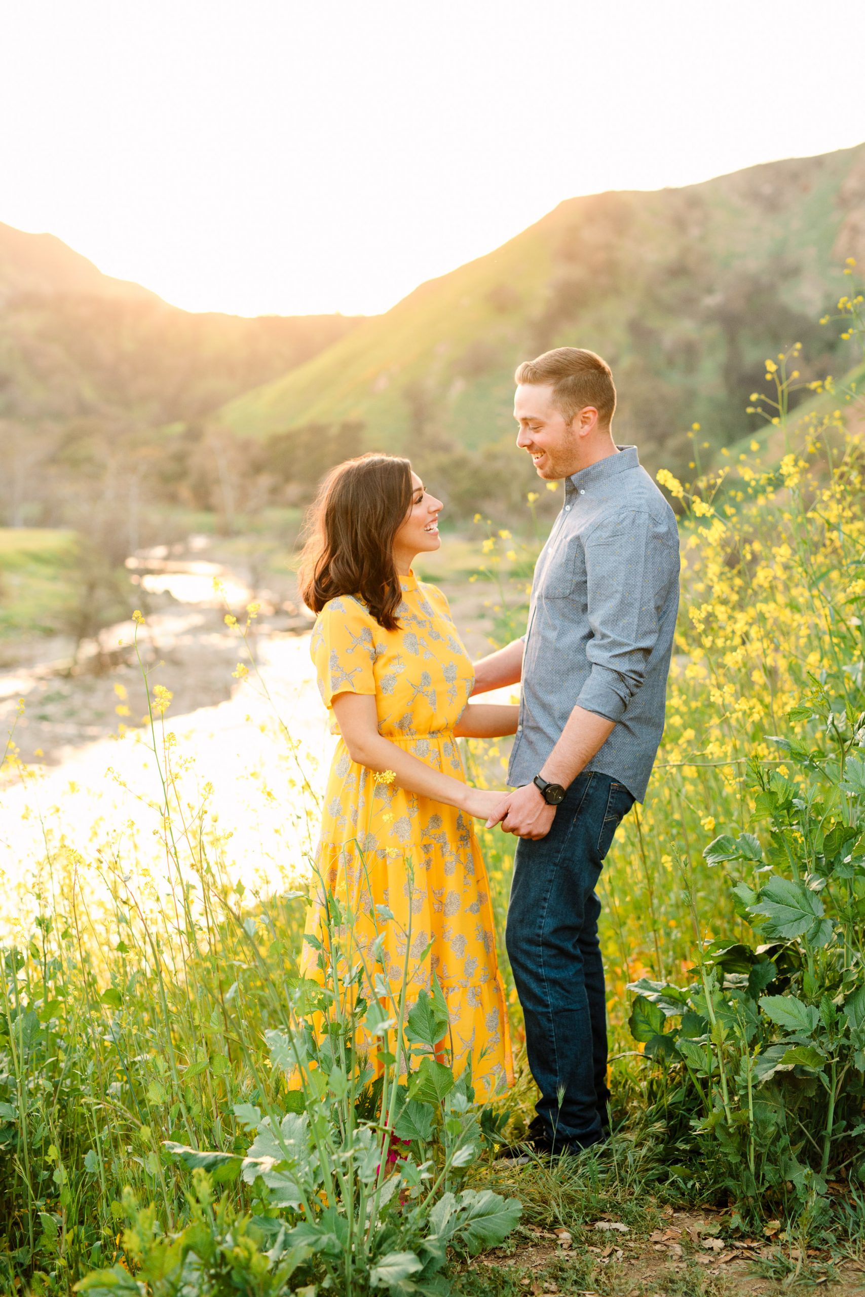 Couple in Malibu Creek Park with blooming mustard seed by Mary Costa Photography