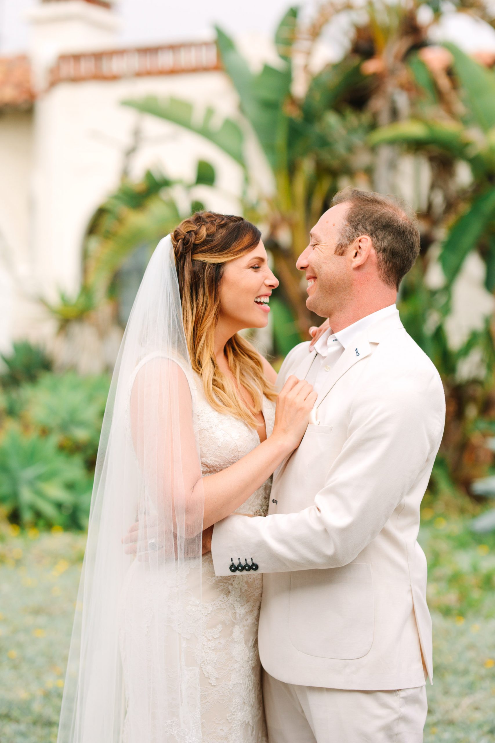 Wedding couple laughing by Mary Costa Photography