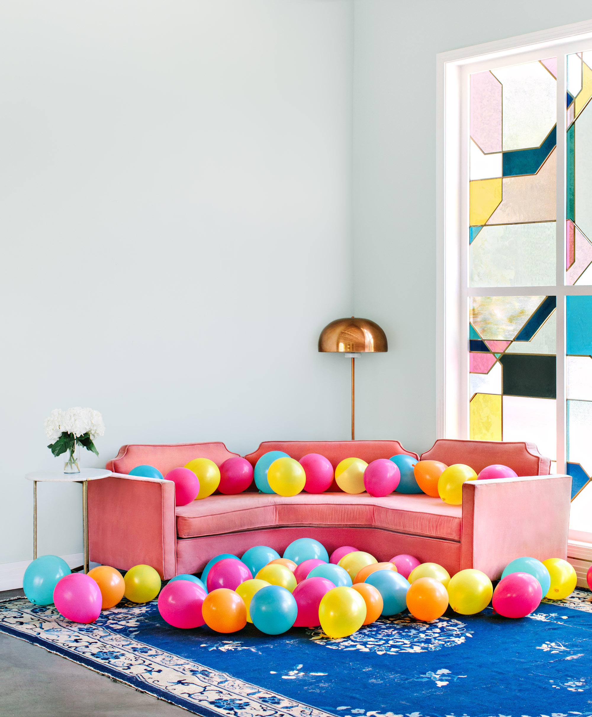 The Fig House's pink couch with colorful balloons - marycostaphotography.com