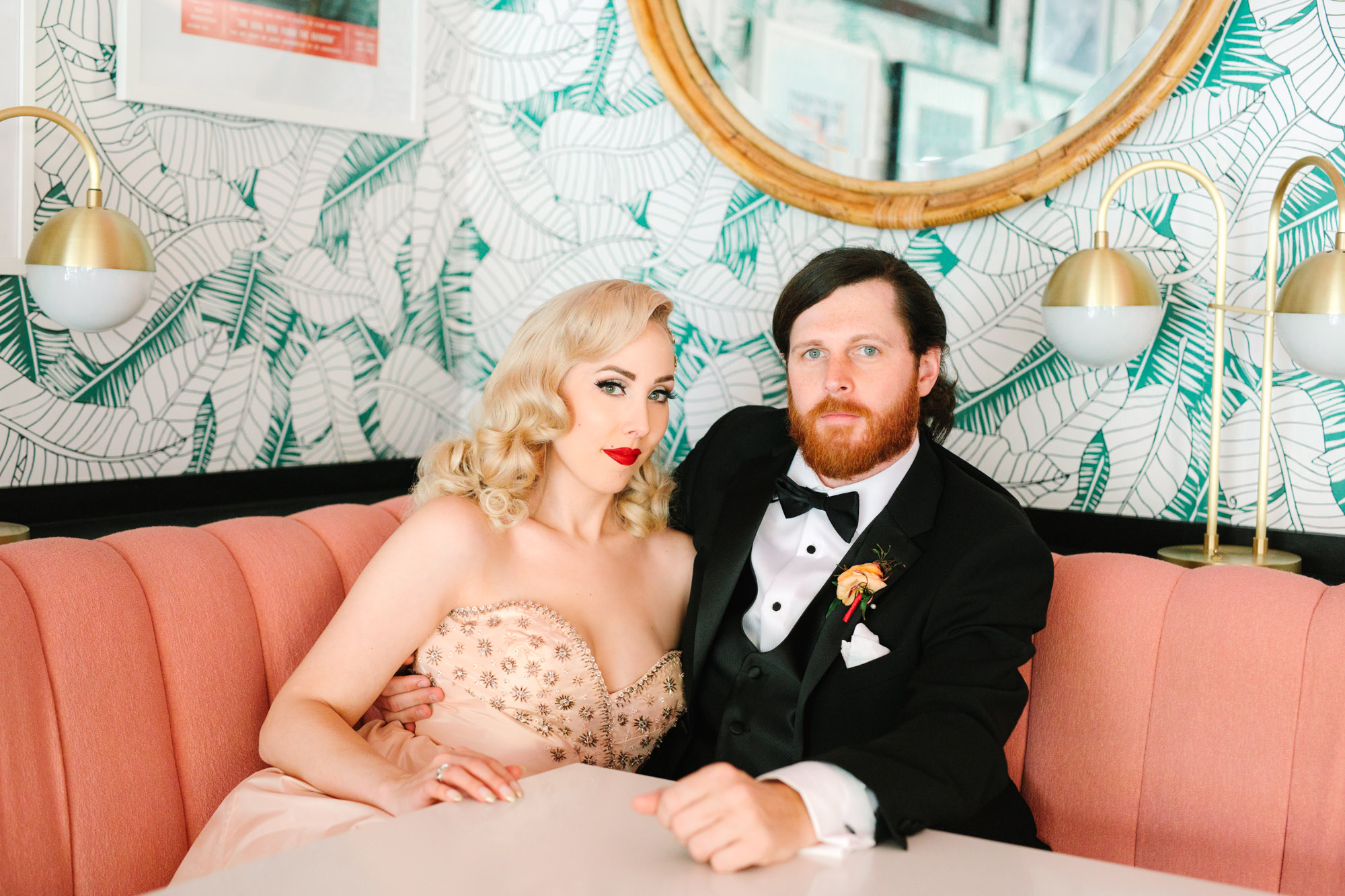 Retro cool bride and groom inside the Sands Hotel and Spa Pink Cabana restaurant www.marycostaweddings.com