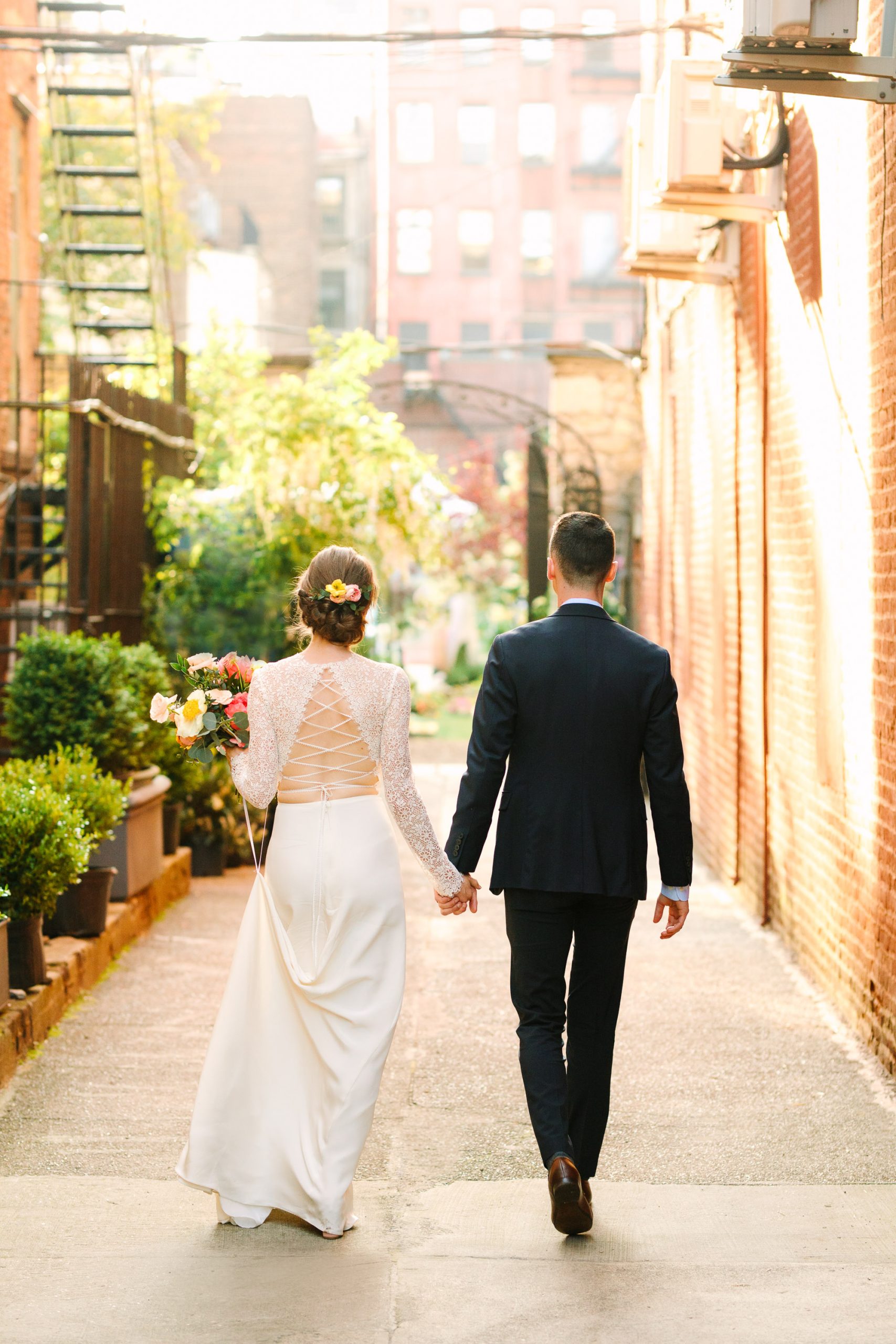 Bride and groom walking in Manhattan - www.marycostaweddings.com