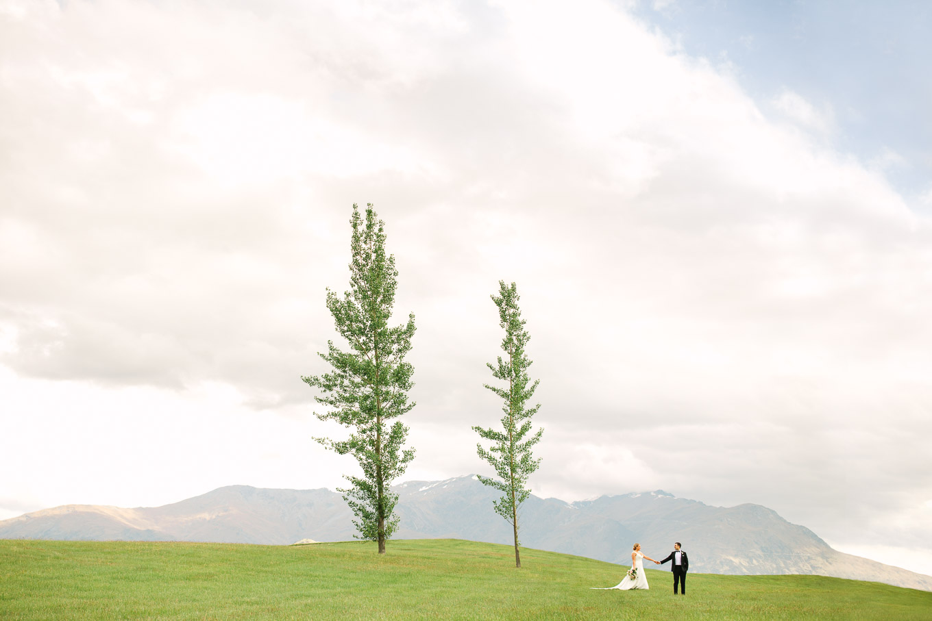 Bride and groom wedding portrait with trees at Millbrook Resort venue in Arrowtown, New Zealand. Queenstown NZ wedding by Mary Costa Photography | www.marycostaweddings.com