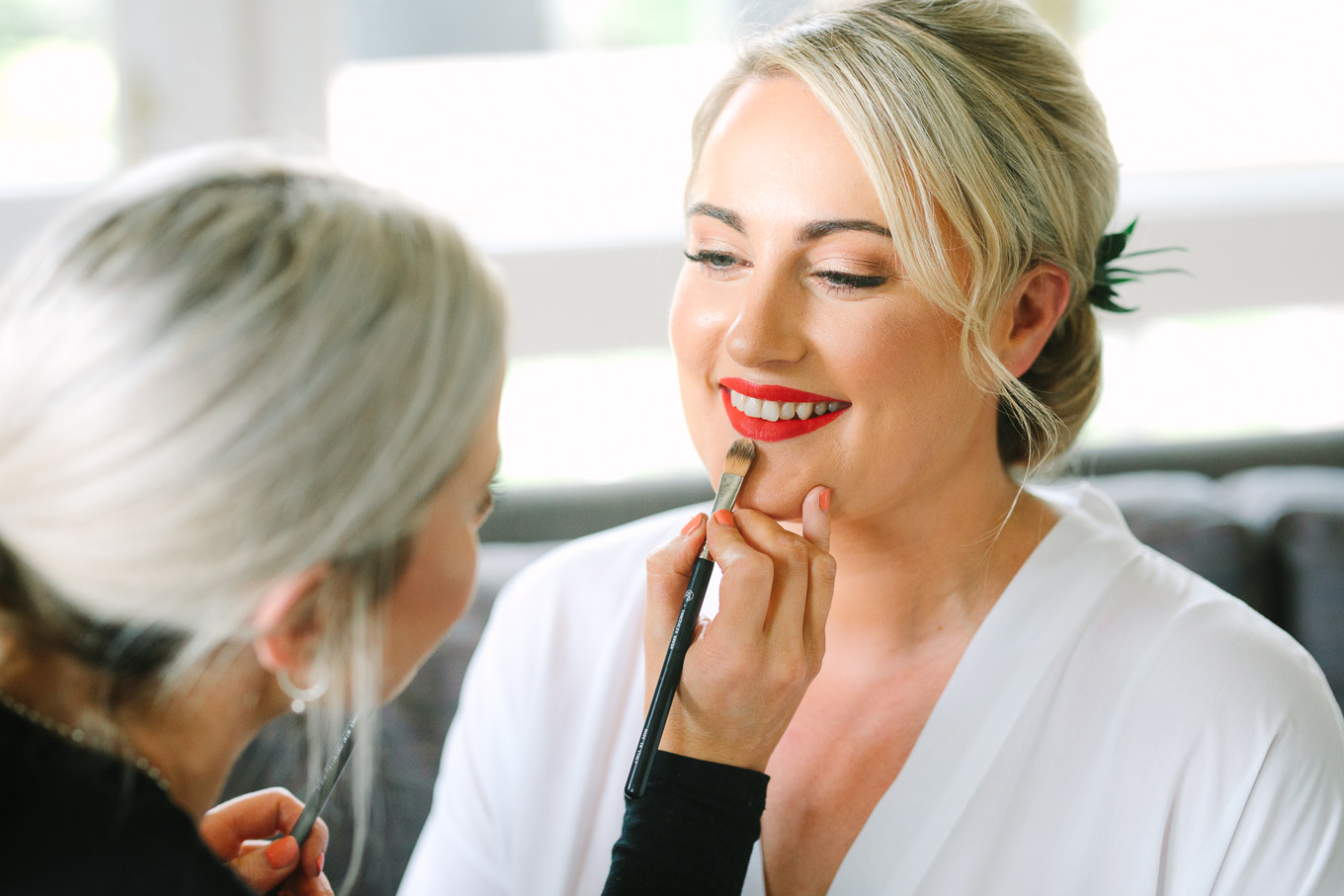 Bride getting red lipstick done. Millbrook Resort Queenstown New Zealand wedding by Mary Costa Photography | www.marycostaweddings.com