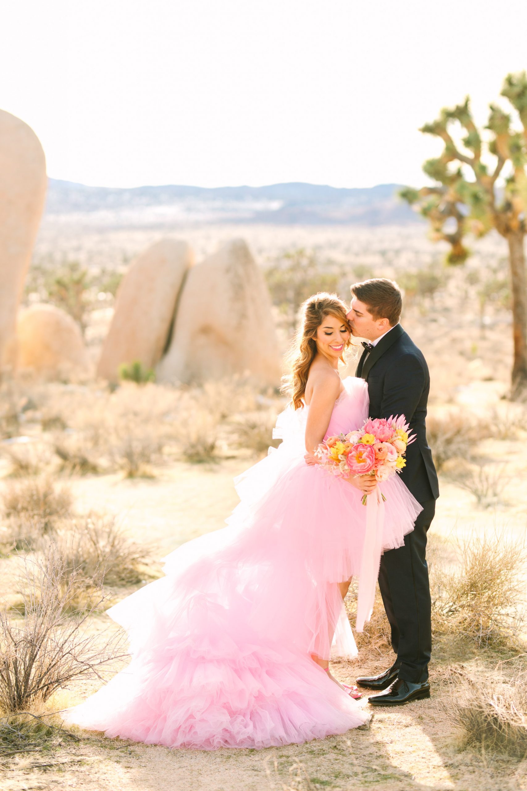 Pink wedding dress Joshua Tree elopement featured on Green Wedding Shoes | Vibrant and elevated wedding photos for fun-loving couples in Southern California #joshuatreewedding #joshuatreeelopement #pinkwedding #greenweddingshoes Source: Mary Costa Photography | Los Angeles
