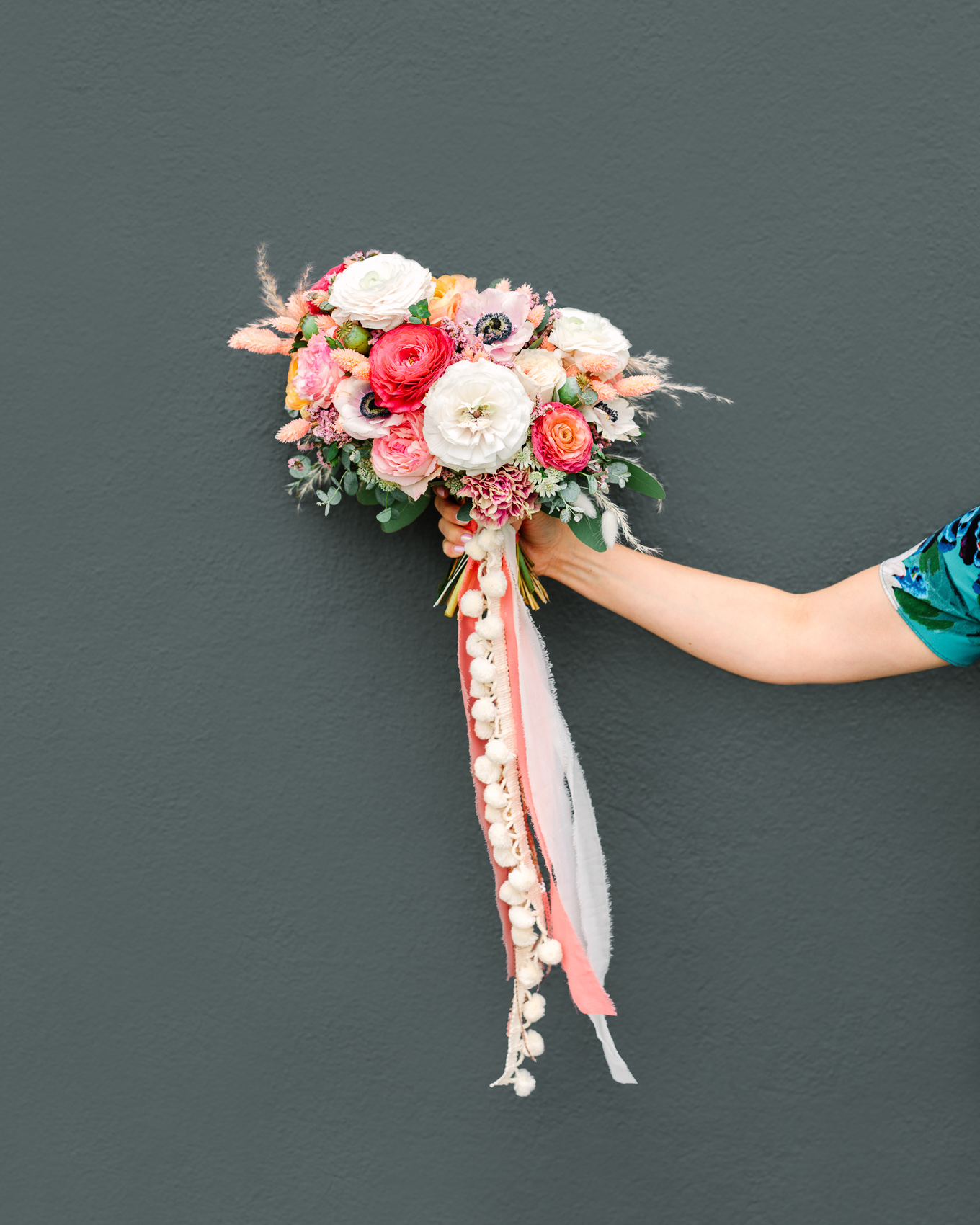 Spring flower bouquet with pom pom ribbons | Beautiful bridal bouquet inspiration and advice | Colorful and elevated wedding photography for fun-loving couples in Southern California | #weddingflowers #weddingbouquet #bridebouquet #bouquetideas #uniquebouquet   Source: Mary Costa Photography | Los Angeles