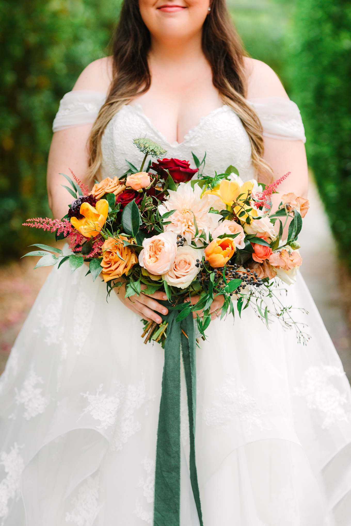 Winter jewel tone organic wedding flowers with emerald ribbon | Beautiful bridal bouquet inspiration and advice | Colorful and elevated wedding photography for fun-loving couples in Southern California | #weddingflowers #weddingbouquet #bridebouquet #bouquetideas #uniquebouquet   Source: Mary Costa Photography | Los Angeles