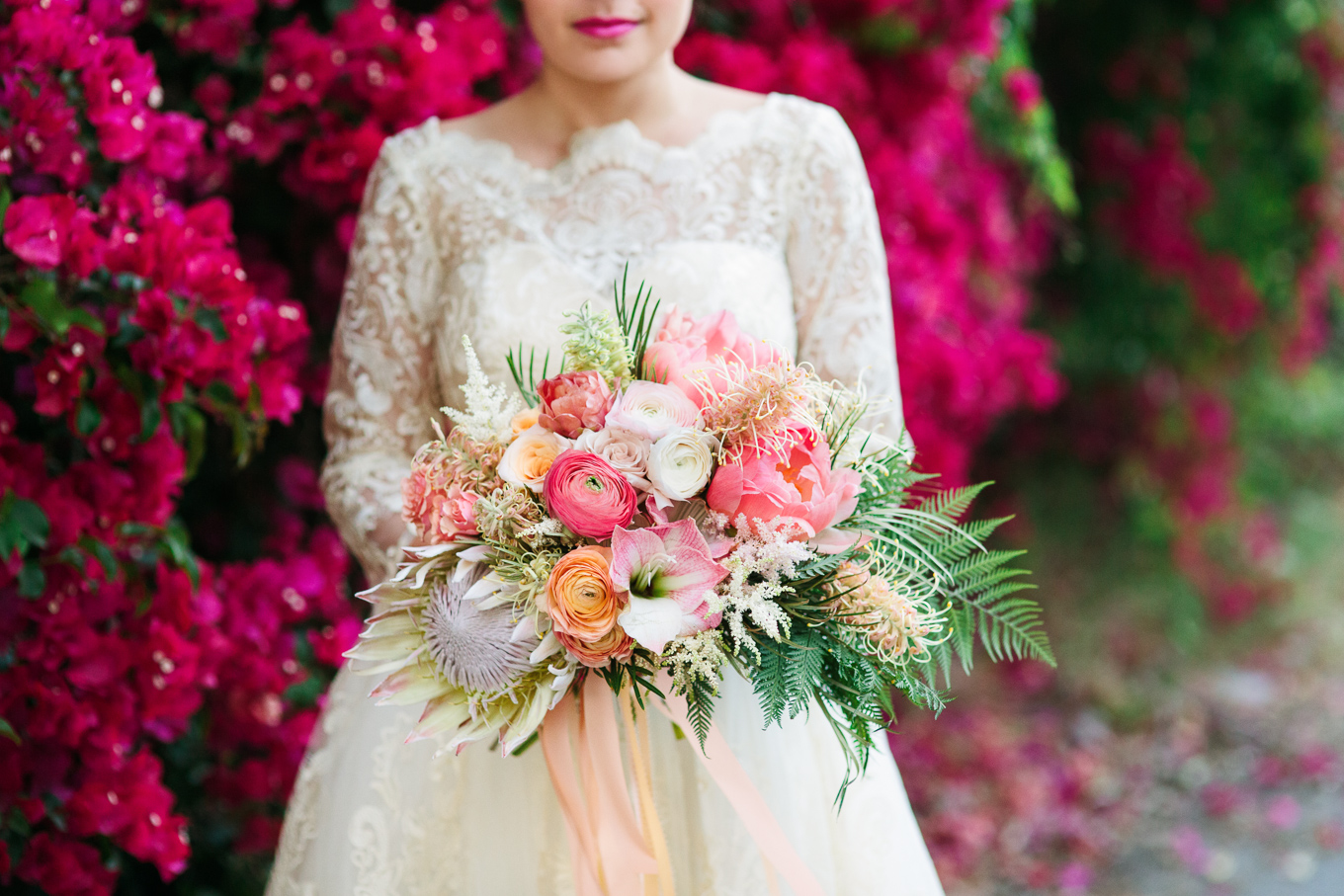 Tropical protea and pink wedding flowers | Beautiful bridal bouquet inspiration and advice | Colorful and elevated wedding photography for fun-loving couples in Southern California | #weddingflowers #weddingbouquet #bridebouquet #bouquetideas #uniquebouquet   Source: Mary Costa Photography | Los Angeles