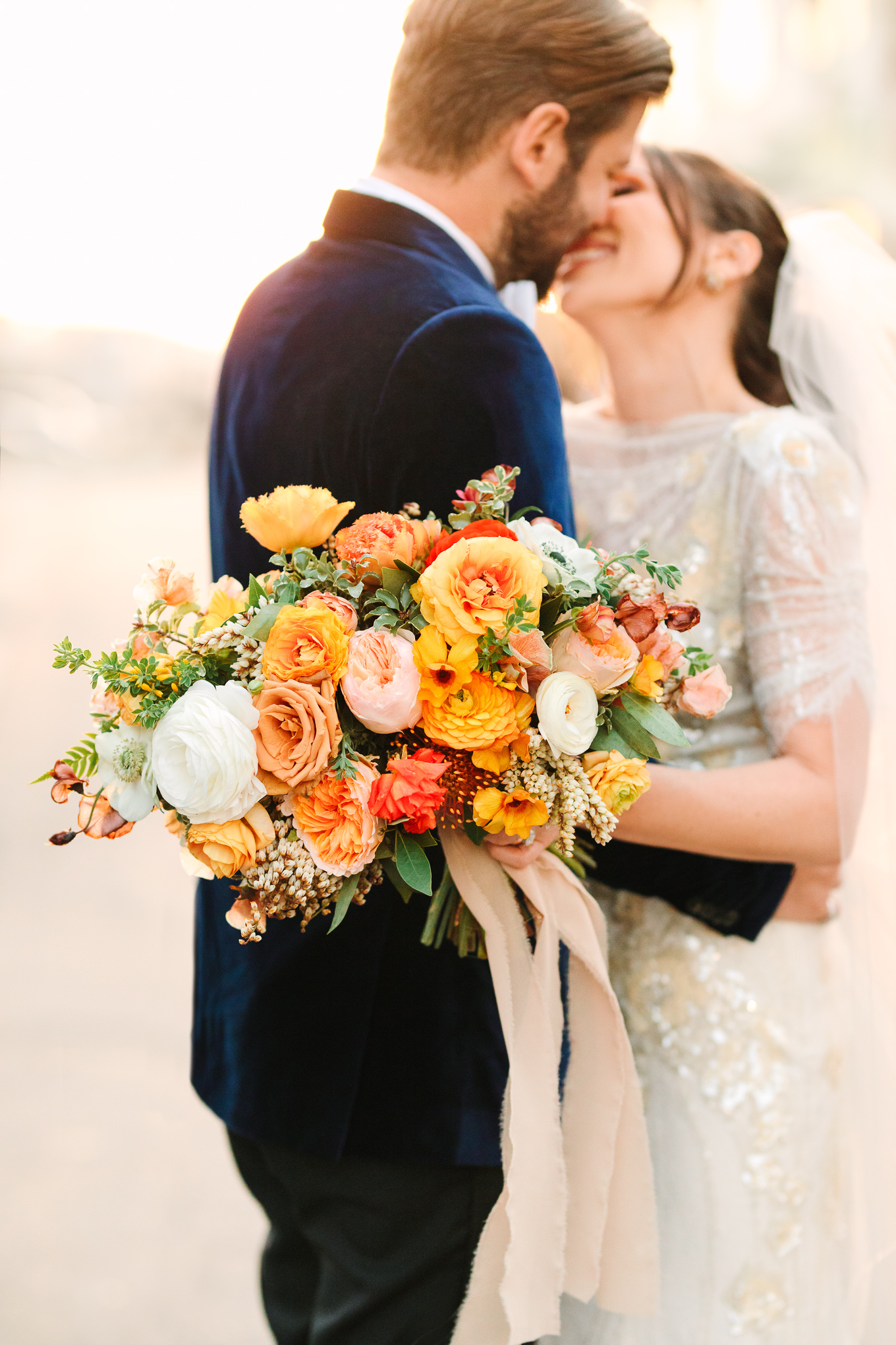 Orange and yellow wedding flowers | Beautiful bridal bouquet inspiration and advice | Colorful and elevated wedding photography for fun-loving couples in Southern California | #weddingflowers #weddingbouquet #bridebouquet #bouquetideas #uniquebouquet   Source: Mary Costa Photography | Los Angeles