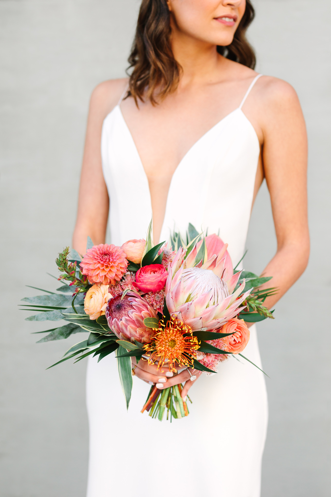 Tropical protea wedding flowers | Beautiful bridal bouquet inspiration and advice | Colorful and elevated wedding photography for fun-loving couples in Southern California | #weddingflowers #weddingbouquet #bridebouquet #bouquetideas #uniquebouquet   Source: Mary Costa Photography | Los Angeles
