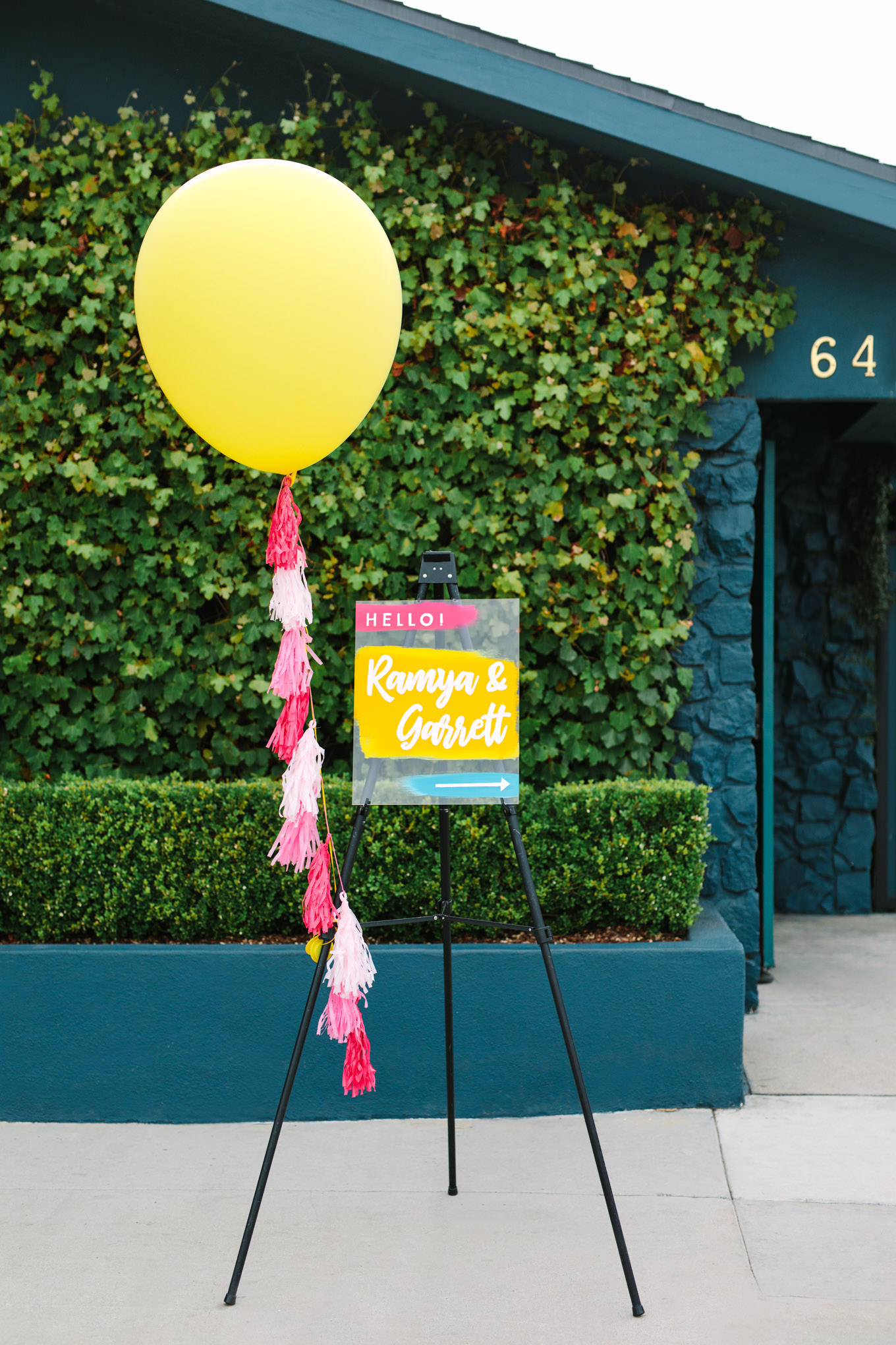 Balloon colorful wedding sign entrance. Two Disney artists create a unique and colorful Indian Fusion wedding at The Fig House Los Angeles, featured on Green Wedding Shoes. | Colorful and elevated wedding inspiration for fun-loving couples in Southern California | #indianwedding #indianfusionwedding #thefighouse #losangeleswedding   Source: Mary Costa Photography | Los Angeles