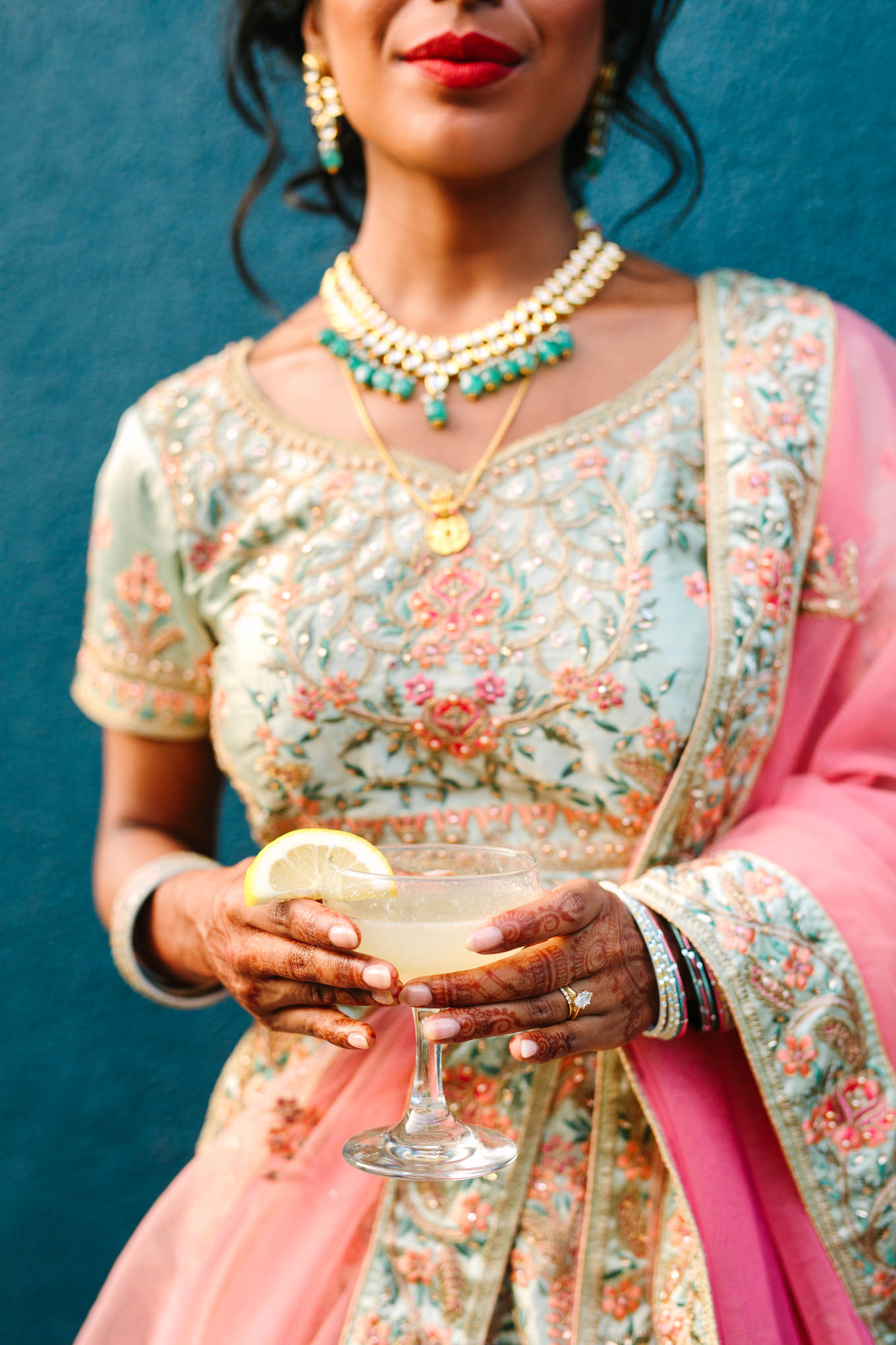 Bride in embroidered gown with Room Forty cocktail. Two Disney artists create a unique and colorful Indian Fusion wedding at The Fig House Los Angeles, featured on Green Wedding Shoes. | Colorful and elevated wedding inspiration for fun-loving couples in Southern California | #indianwedding #indianfusionwedding #thefighouse #losangeleswedding   Source: Mary Costa Photography | Los Angeles