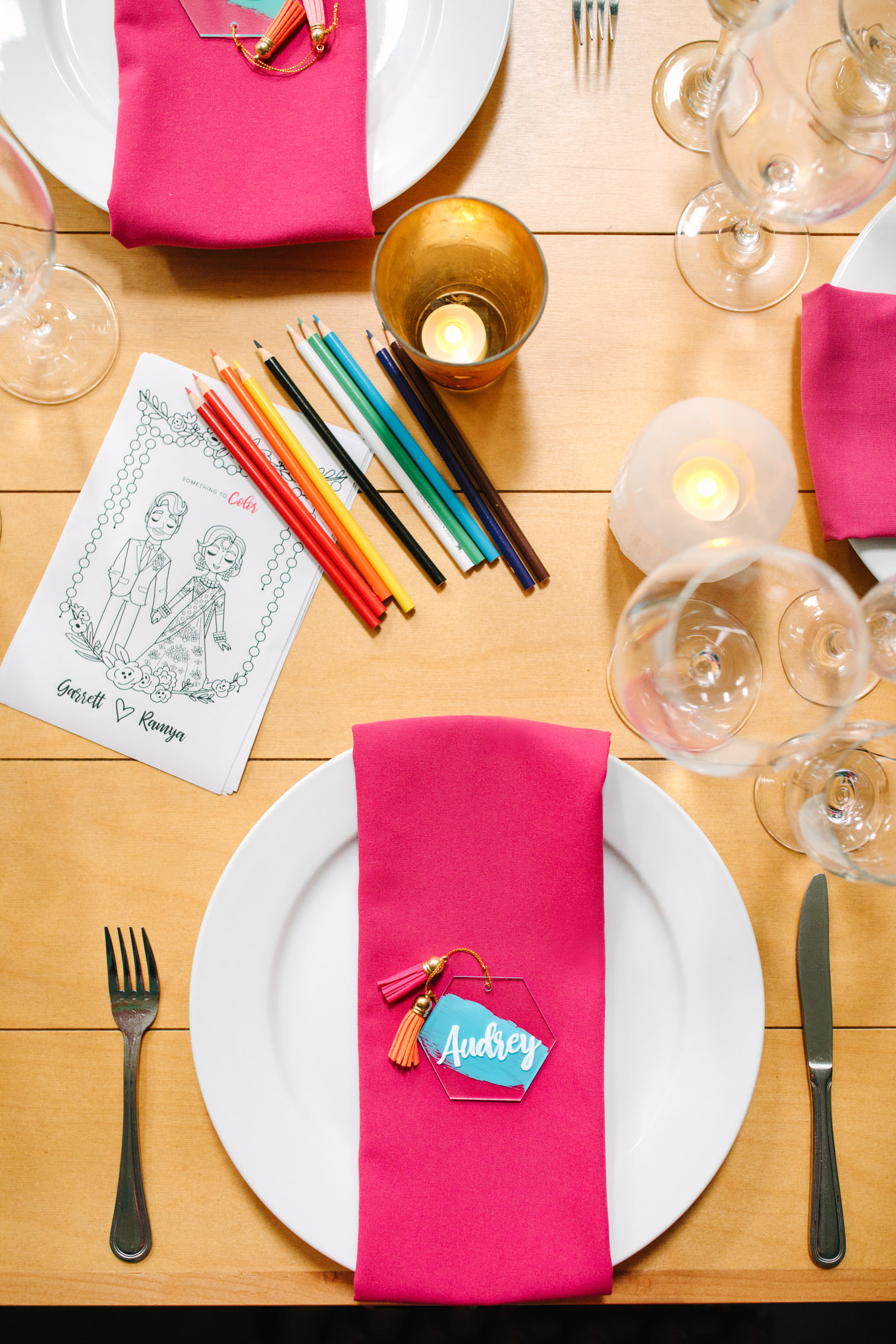 Colorful pink napkins and coloring page of bride and groom. Two Disney artists create a unique and colorful Indian Fusion wedding at The Fig House Los Angeles, featured on Green Wedding Shoes. | Colorful and elevated wedding inspiration for fun-loving couples in Southern California | #indianwedding #indianfusionwedding #thefighouse #losangeleswedding   Source: Mary Costa Photography | Los Angeles