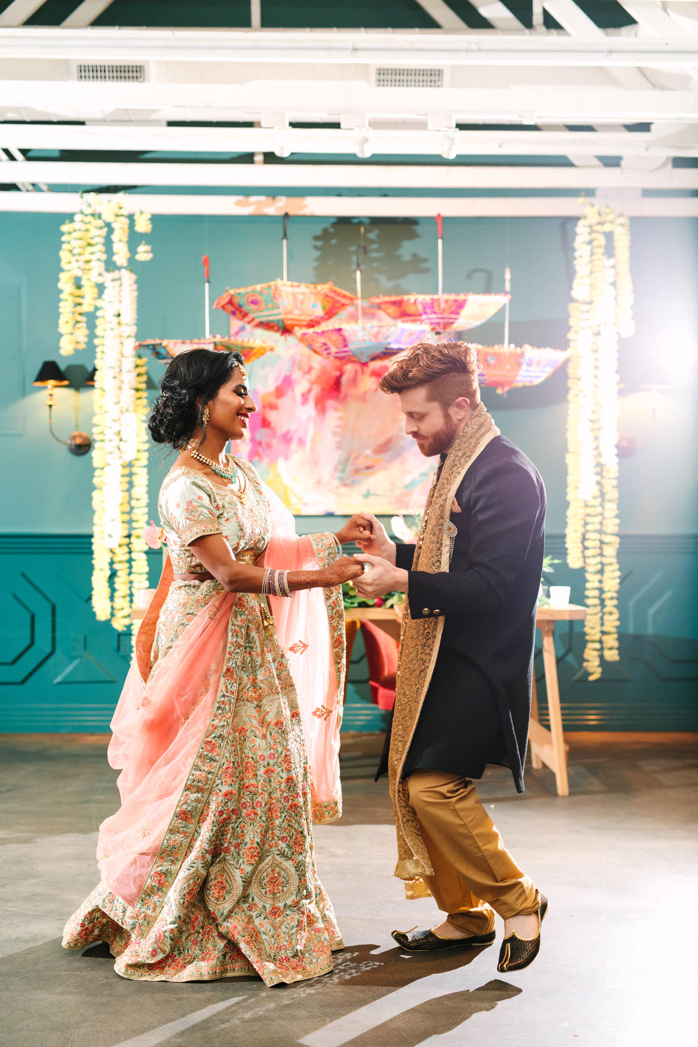 Bride and groom's first dance. Two Disney artists create a unique and colorful Indian Fusion wedding at The Fig House Los Angeles, featured on Green Wedding Shoes. | Colorful and elevated wedding inspiration for fun-loving couples in Southern California | #indianwedding #indianfusionwedding #thefighouse #losangeleswedding   Source: Mary Costa Photography | Los Angeles