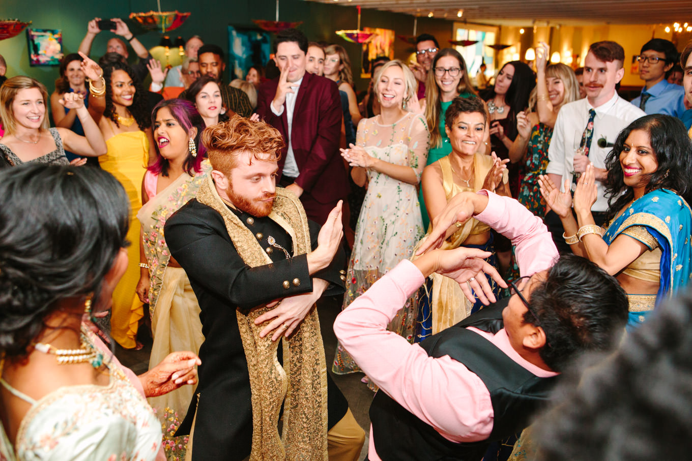 Wedding reception dance party. Two Disney artists create a unique and colorful Indian Fusion wedding at The Fig House Los Angeles, featured on Green Wedding Shoes. | Colorful and elevated wedding inspiration for fun-loving couples in Southern California | #indianwedding #indianfusionwedding #thefighouse #losangeleswedding   Source: Mary Costa Photography | Los Angeles
