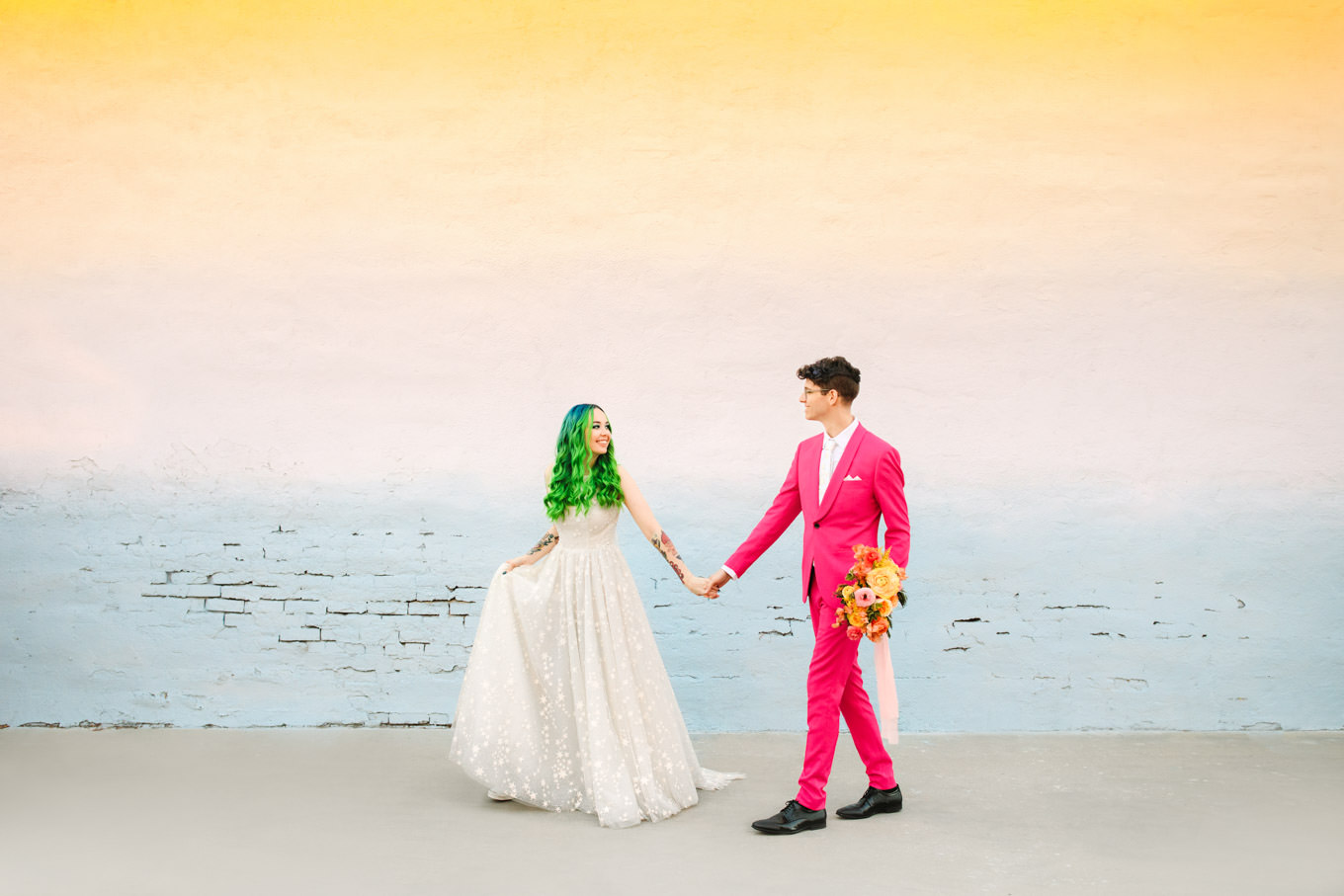 Unique Space wedding with groom in hot pink suit and bride with neon hair | Engagement, elopement, and wedding photography roundup of Mary Costa’s favorite images from 2020 | Colorful and elevated photography for fun-loving couples in Southern California | #2020wedding #elopement #weddingphoto #weddingphotography   Source: Mary Costa Photography | Los Angeles