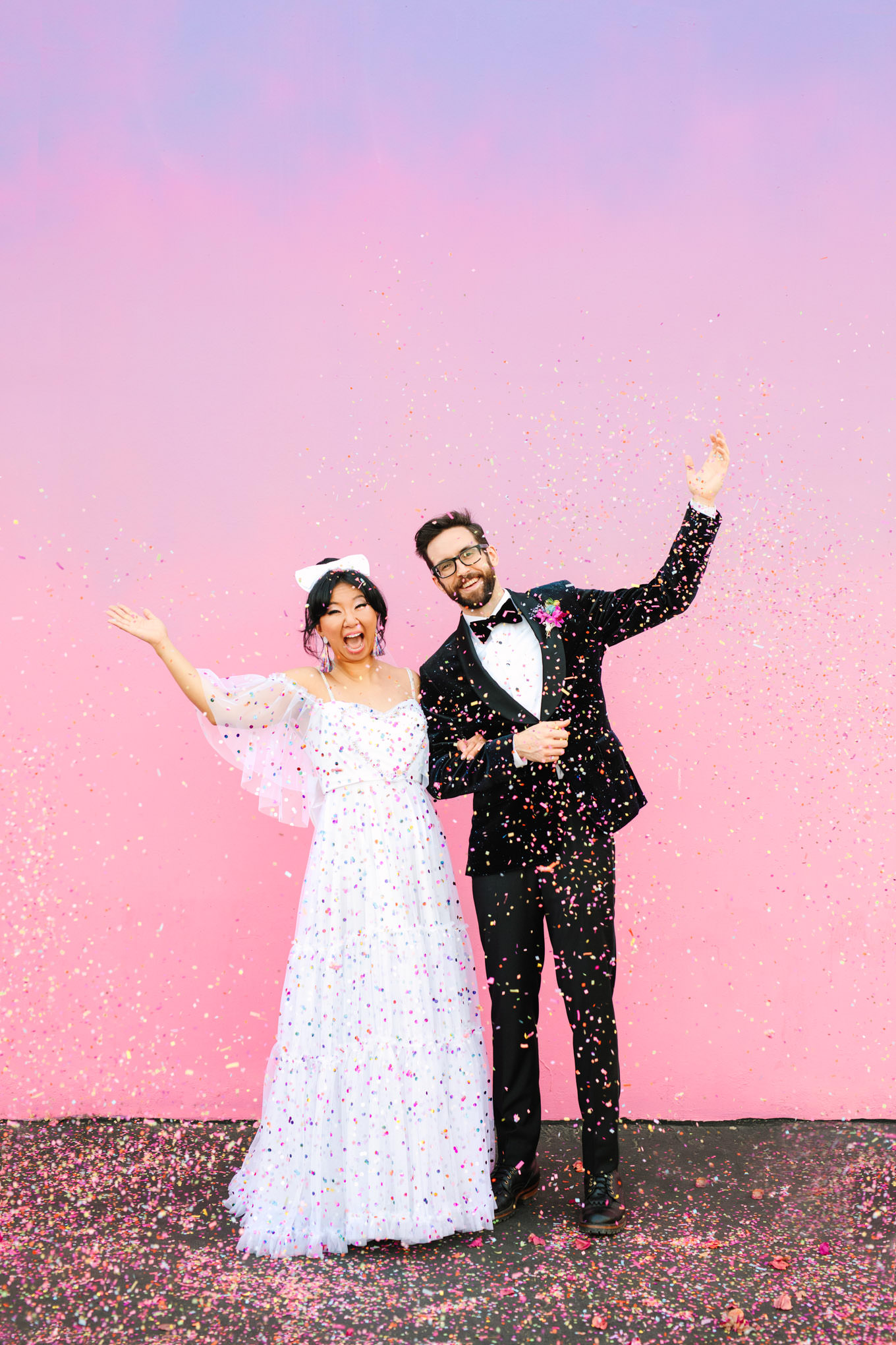 Confetti toss at colorful pink wall elopement | Engagement, elopement, and wedding photography roundup of Mary Costa’s favorite images from 2020 | Colorful and elevated photography for fun-loving couples in Southern California | #2020wedding #elopement #weddingphoto #weddingphotography #microwedding   Source: Mary Costa Photography | Los Angeles