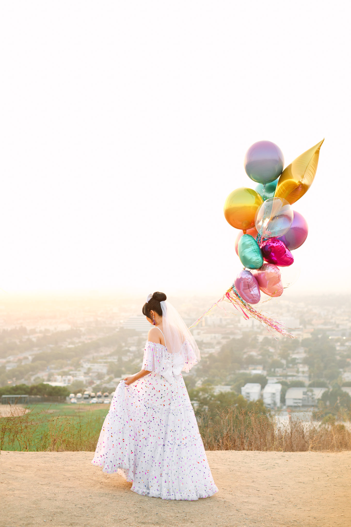 Bride carrying balloons in confetti dress | Engagement, elopement, and wedding photography roundup of Mary Costa’s favorite images from 2020 | Colorful and elevated photography for fun-loving couples in Southern California | #2020wedding #elopement #weddingphoto #weddingphotography #microwedding   Source: Mary Costa Photography | Los Angeles