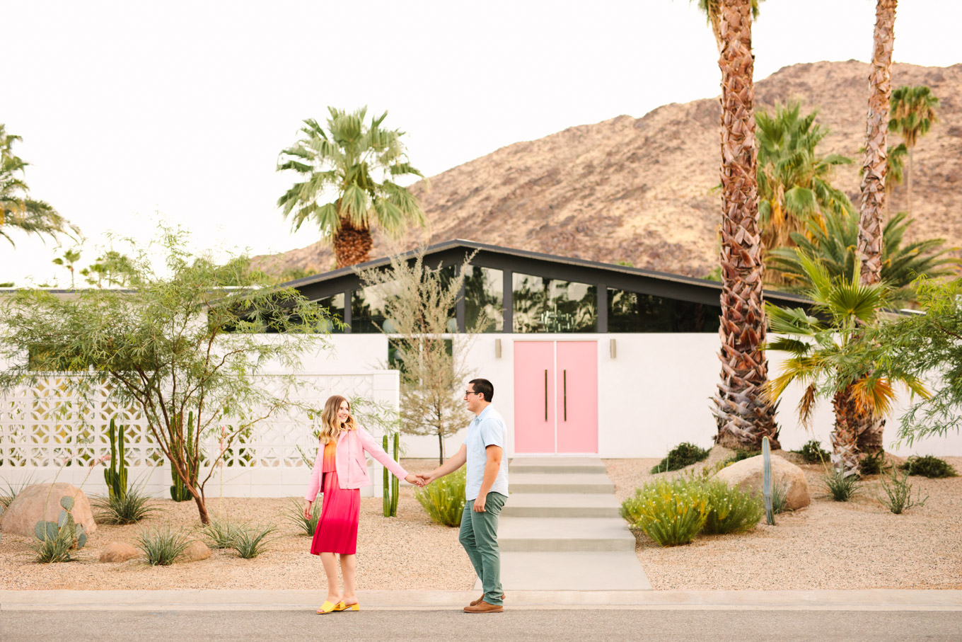 Pink door Palm Springs engagement session | Engagement, elopement, and wedding photography roundup of Mary Costa’s favorite images from 2020 | Colorful and elevated photography for fun-loving couples in Southern California | #2020wedding #elopement #weddingphoto #weddingphotography #microwedding   Source: Mary Costa Photography | Los Angeles