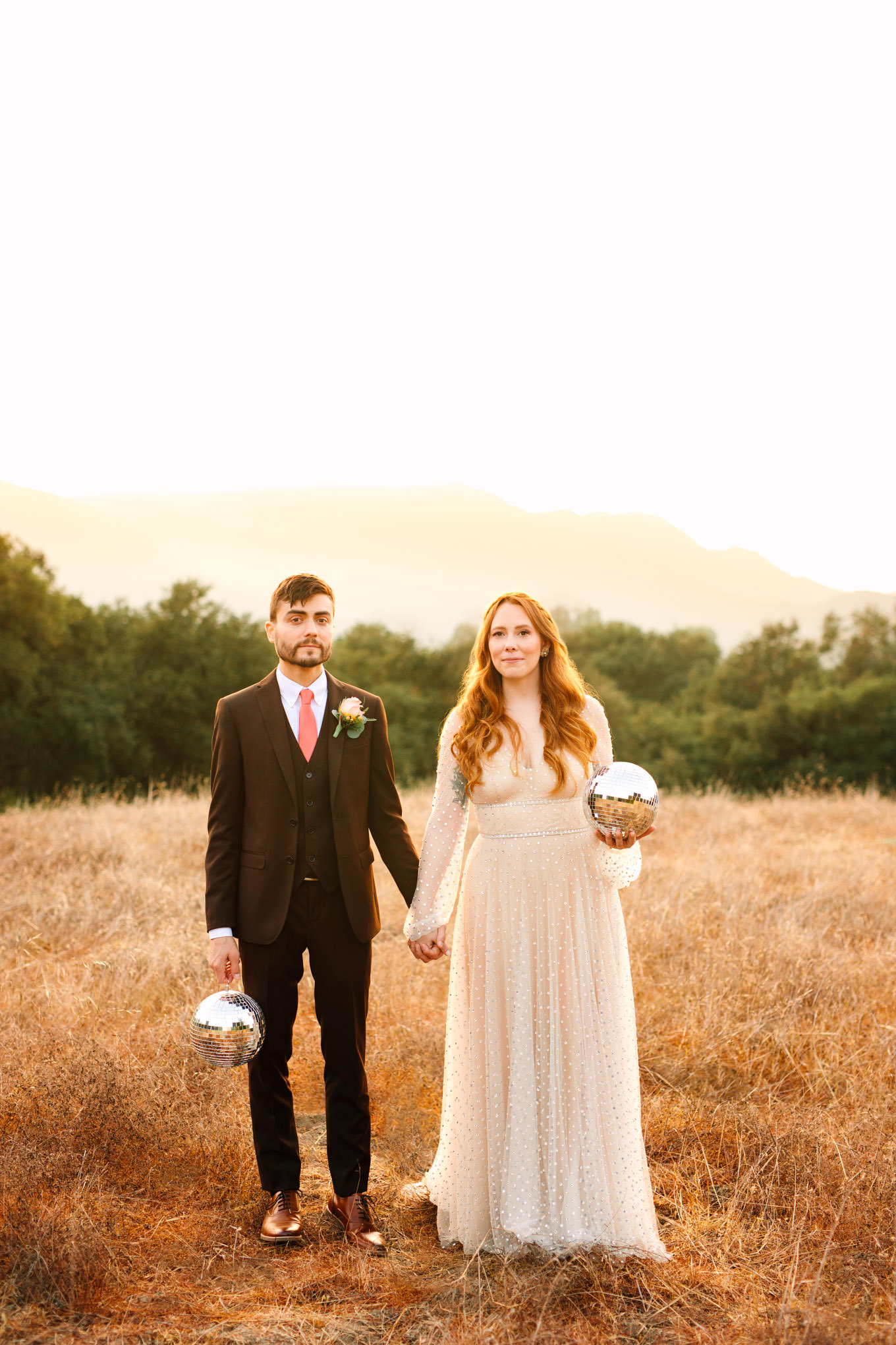 Bride and groom with disco balls at Topanga Canyon elopement Los Angeles Chinatown engagement session | Engagement, elopement, and wedding photography roundup of Mary Costa’s favorite images from 2020 | Colorful and elevated photography for fun-loving couples in Southern California | #2020wedding #elopement #weddingphoto #weddingphotography #microwedding   Source: Mary Costa Photography | Los Angeles