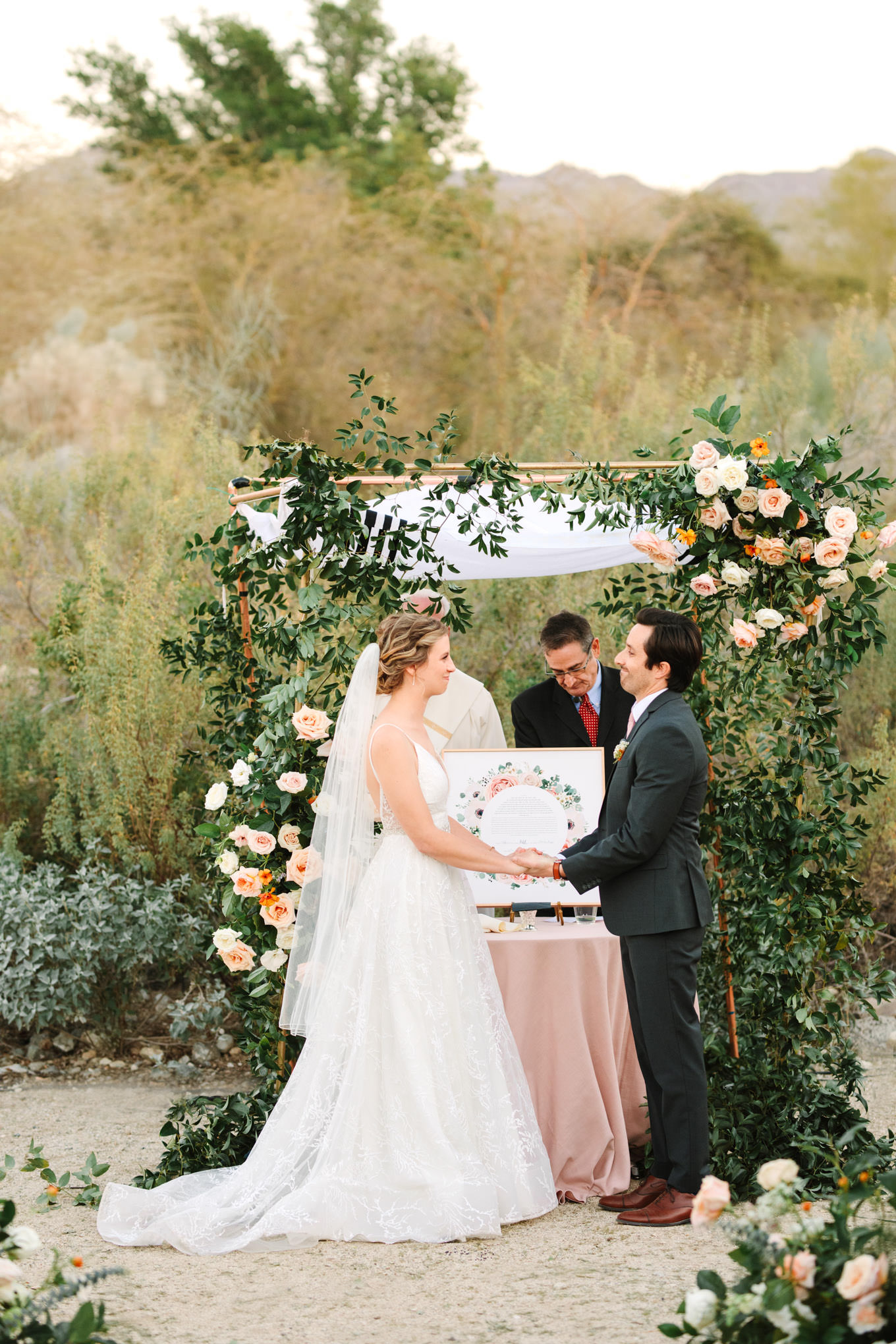 Bride and groom under wedding chuppah | Living Desert Zoo & Gardens wedding with unique details | Elevated and colorful wedding photography for fun-loving couples in Southern California |  #PalmSprings #palmspringsphotographer #gardenwedding #palmspringswedding  Source: Mary Costa Photography | Los Angeles wedding photographer 