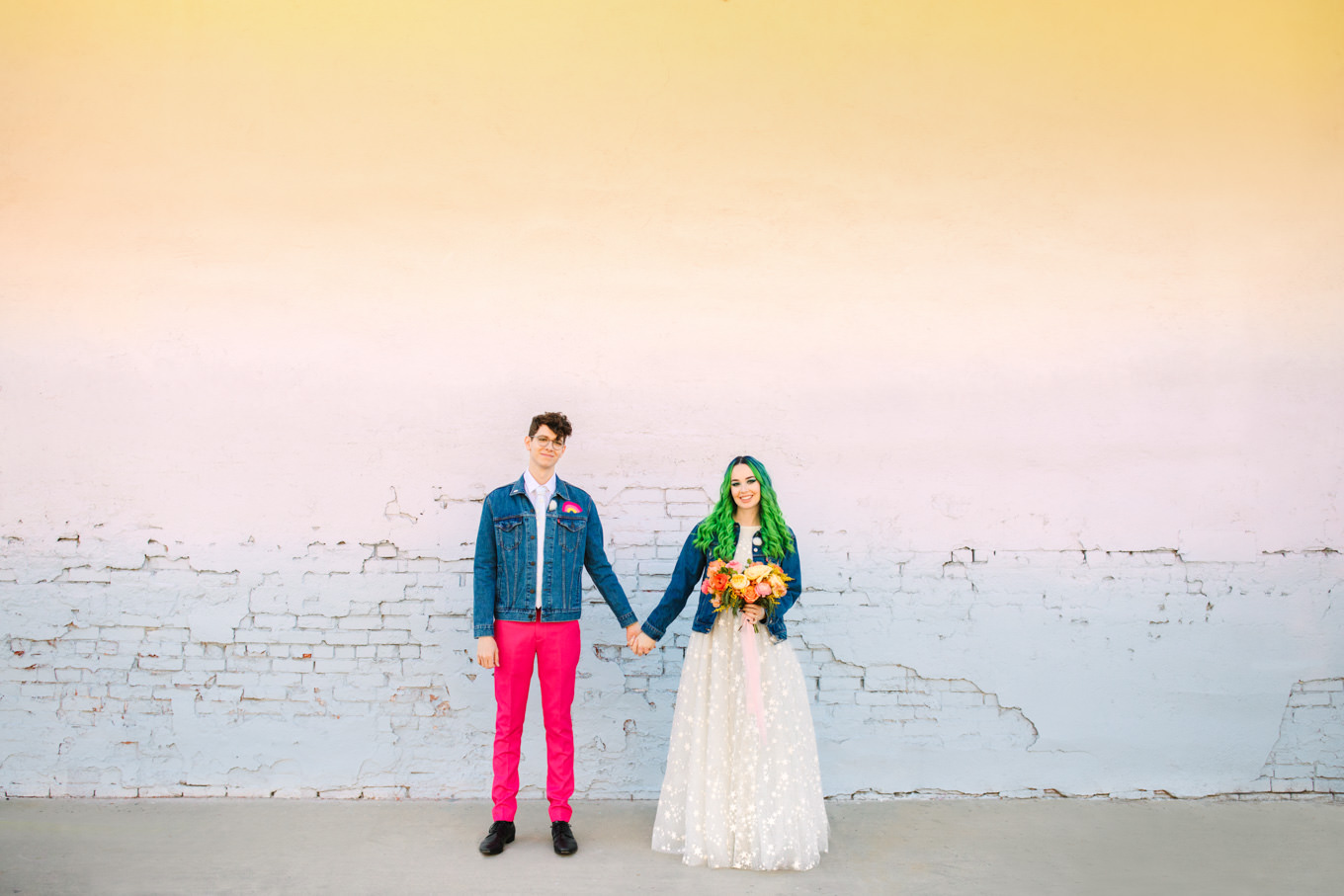 Bride and groom in matching jean jackets | Colorful wedding at The Unique Space Los Angeles published in The Knot Magazine | Fresh and colorful photography for fun-loving couples in Southern California | #colorfulwedding #losangeleswedding #weddingphotography #uniquespace Source: Mary Costa Photography | Los Angeles