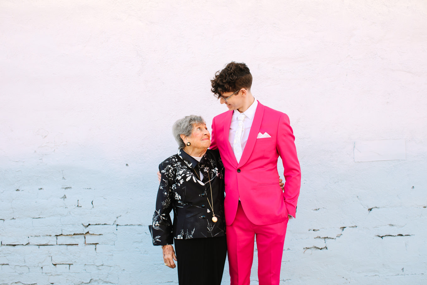 Groom in hot pink suit with his grandmother | Colorful wedding at The Unique Space Los Angeles published in The Knot Magazine | Fresh and colorful photography for fun-loving couples in Southern California | #colorfulwedding #losangeleswedding #weddingphotography #uniquespace Source: Mary Costa Photography | Los Angeles