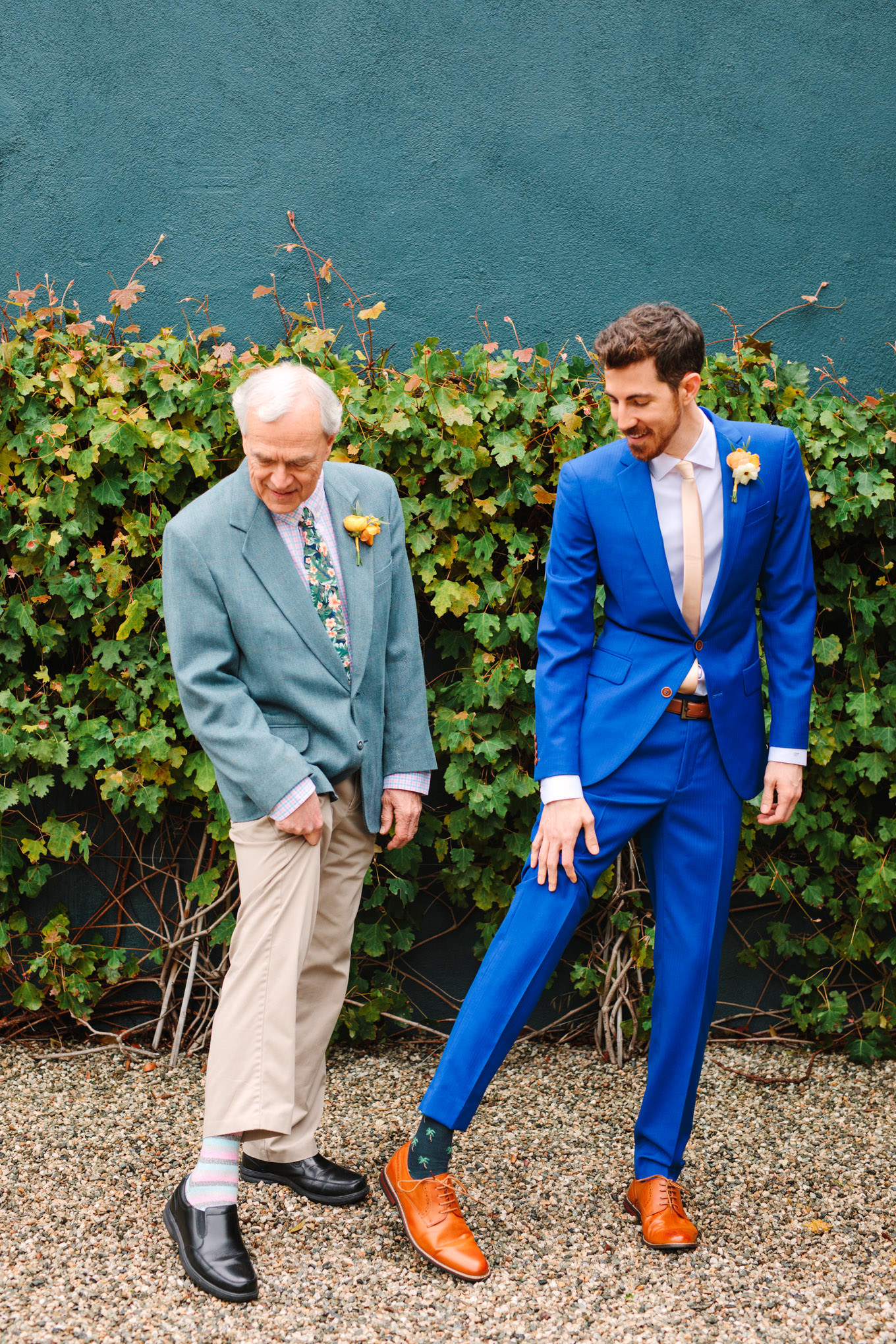 Groom and dad showing off socks | TV inspired wedding at The Fig House Los Angeles | Published on The Knot | Fresh and colorful photography for fun-loving couples in Southern California | #losangeleswedding #TVwedding #colorfulwedding #theknot   Source: Mary Costa Photography | Los Angeles wedding photographer