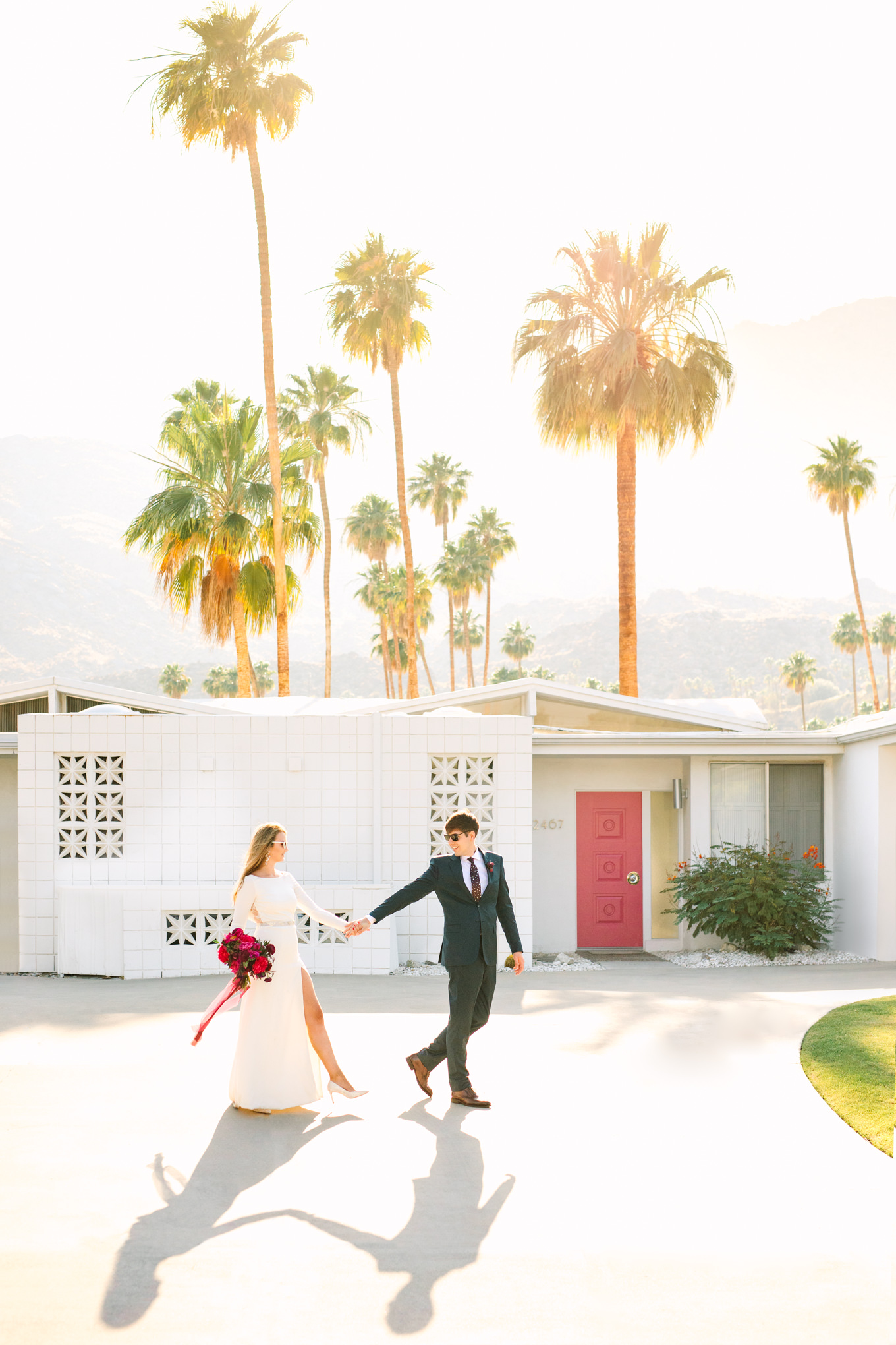 Mid Century Modern house with pink door | Colorful jewel tone Palm Springs elopement | Fresh and colorful photography for fun-loving couples in Southern California | #colorfulelopement #palmspringselopement #elopementphotography #palmspringswedding Source: Mary Costa Photography | Los Angeles