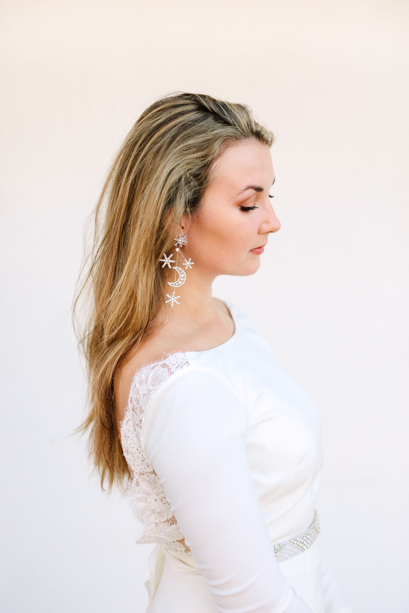 Bride with celestial earrings | Colorful jewel tone Palm Springs elopement | Fresh and colorful photography for fun-loving couples in Southern California | #colorfulelopement #palmspringselopement #elopementphotography #palmspringswedding Source: Mary Costa Photography | Los Angeles