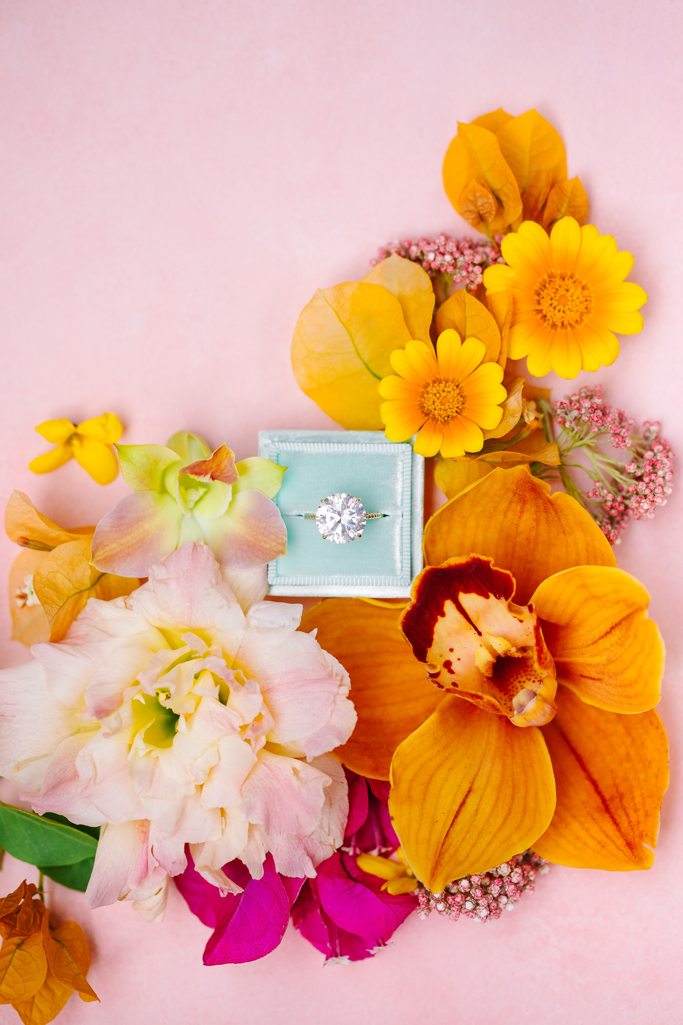 Pink floral flatlay with large diamond engagement ring | Kindred Presets x Mary Costa Photography Sands Hotel Ad Campaign | Colorful Palm Springs wedding photography | #palmspringsphotographer #lightroompresets #sandshotel #pinkhotel   Source: Mary Costa Photography | Los Angeles