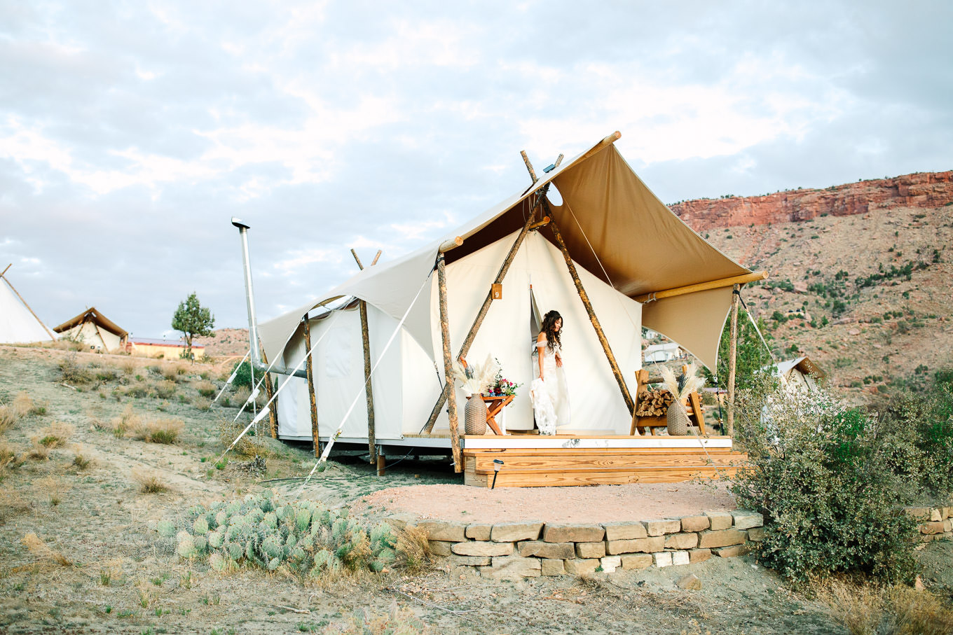 Bride leaving tent at camping elopement | Zion Under Canvas Elopement at Sunrise | Colorful adventure elopement photography | #utahelopement #zionelopement #zionwedding #undercanvaszion #sunriseelopement  Source: Mary Costa Photography | Los Angeles