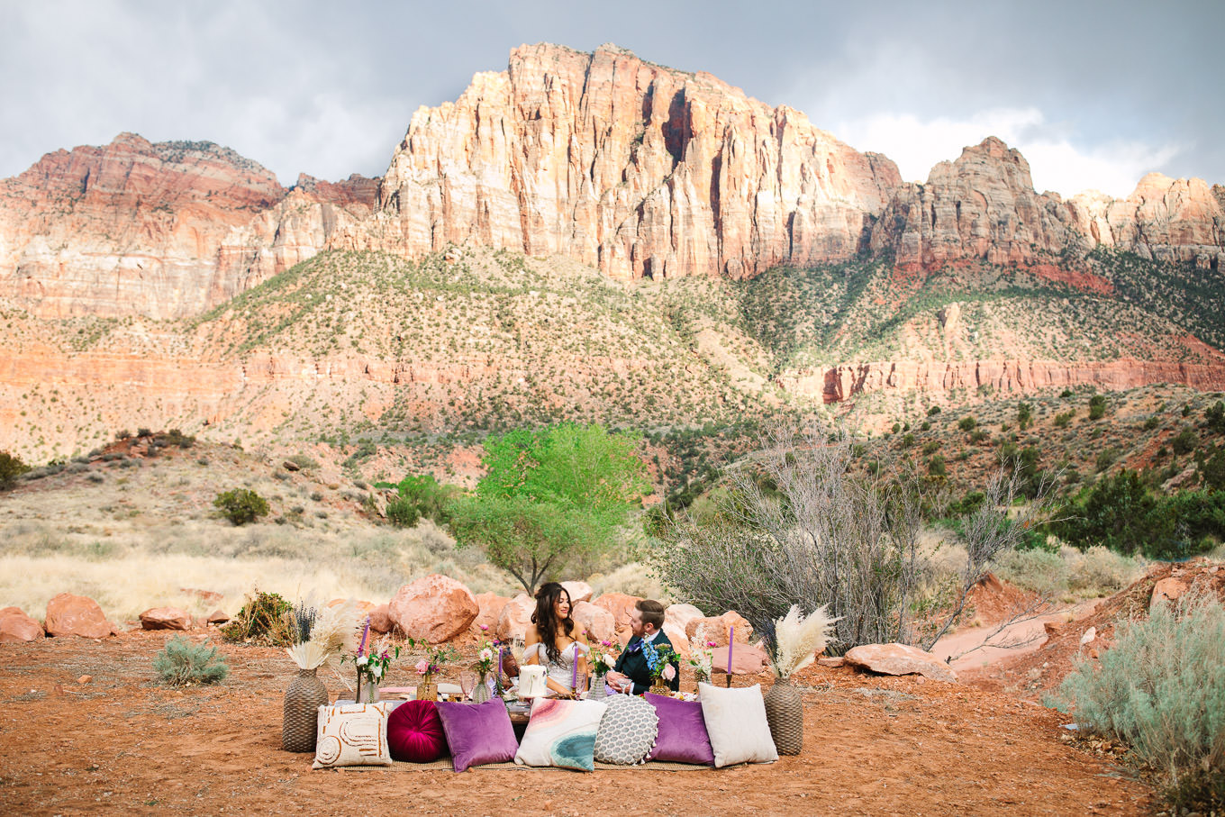 Purple and jewel tone picnic setup | Zion National Park elopement | Colorful adventure elopement photography | #utahelopement #zionelopement #zionwedding #undercanvaszion #picnicwedding  Source: Mary Costa Photography | Los Angeles