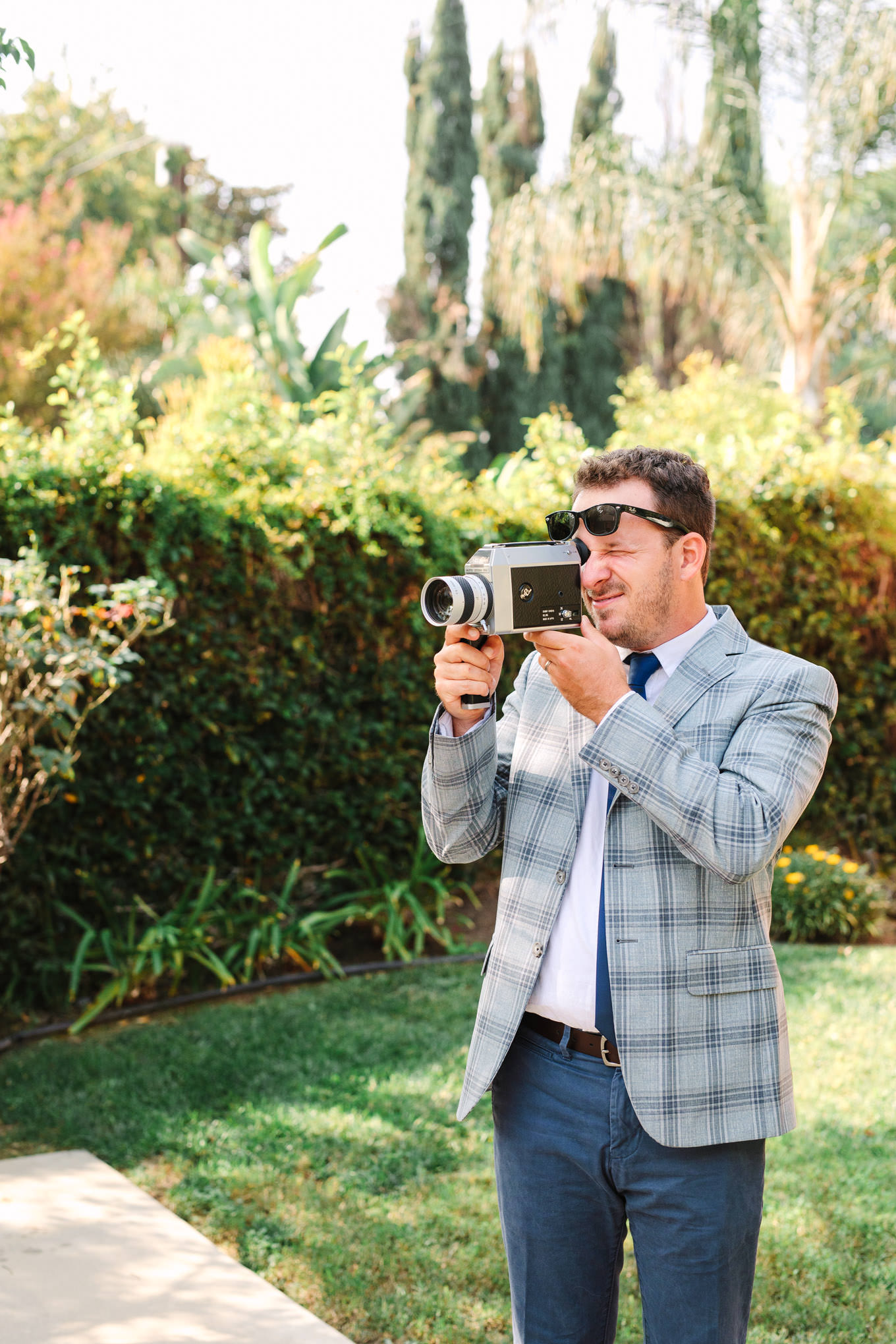 Behind the scenes at outdoor micro wedding | Vibrant backyard micro wedding featured on Green Wedding Shoes | Colorful LA wedding photography | #losangeleswedding #backyardwedding #microwedding #laweddingphotographer Source: Mary Costa Photography | Los Angeles