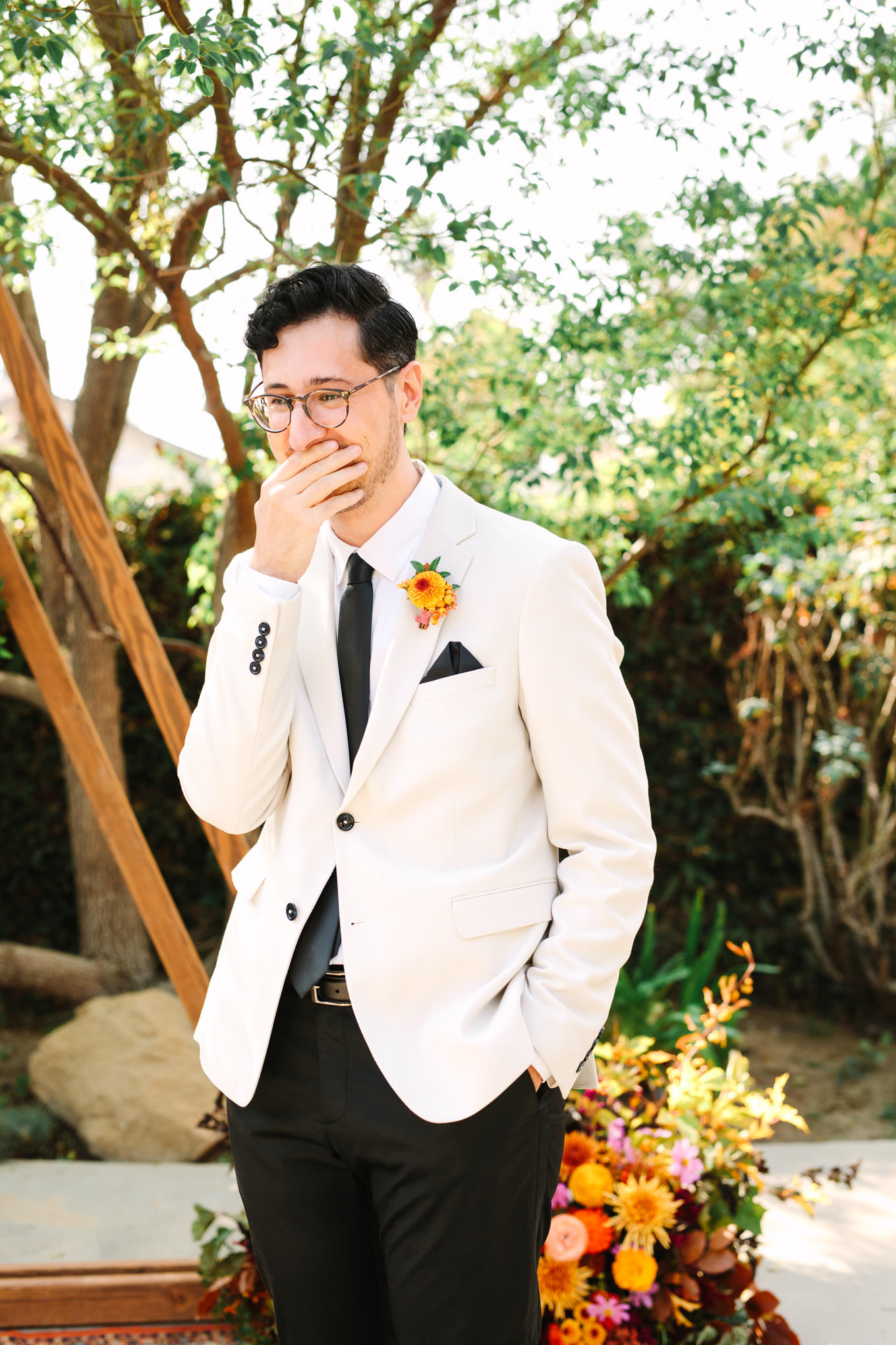 Groom reaction to bridal first look | Vibrant backyard micro wedding featured on Green Wedding Shoes | Colorful LA wedding photography | #losangeleswedding #backyardwedding #microwedding #laweddingphotographer Source: Mary Costa Photography | Los Angeles