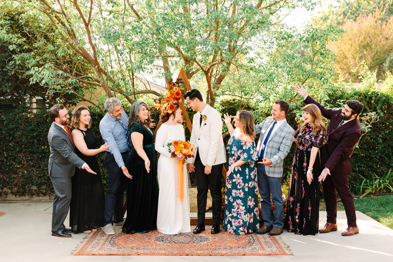 Family photo with bride and groom | Vibrant backyard micro wedding featured on Green Wedding Shoes | Colorful LA wedding photography | #losangeleswedding #backyardwedding #microwedding #laweddingphotographer Source: Mary Costa Photography | Los Angeles