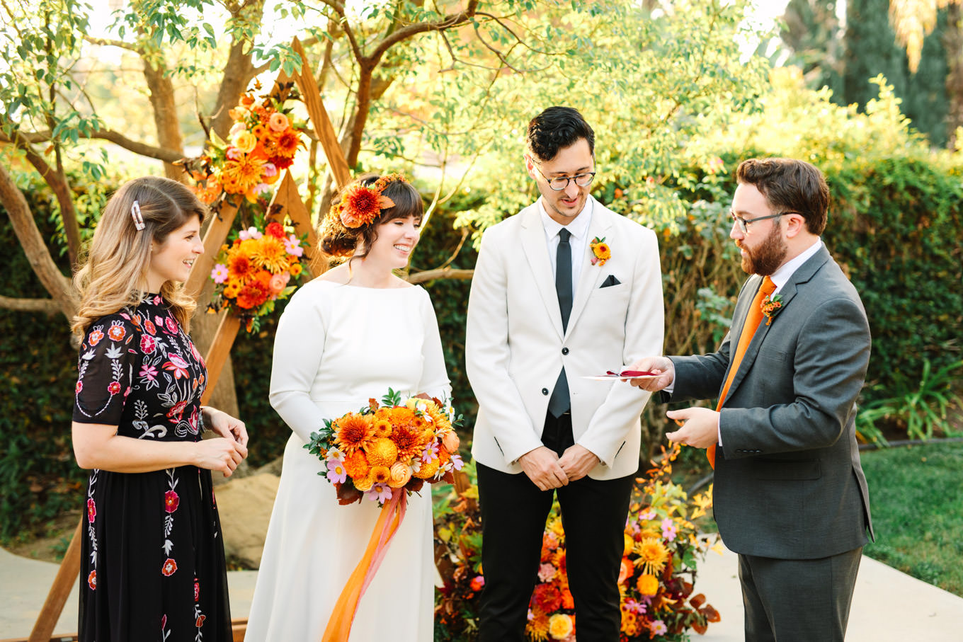 Bride and groom with unique part of ceremony | Vibrant backyard micro wedding featured on Green Wedding Shoes | Colorful LA wedding photography | #losangeleswedding #backyardwedding #microwedding #laweddingphotographer Source: Mary Costa Photography | Los Angeles