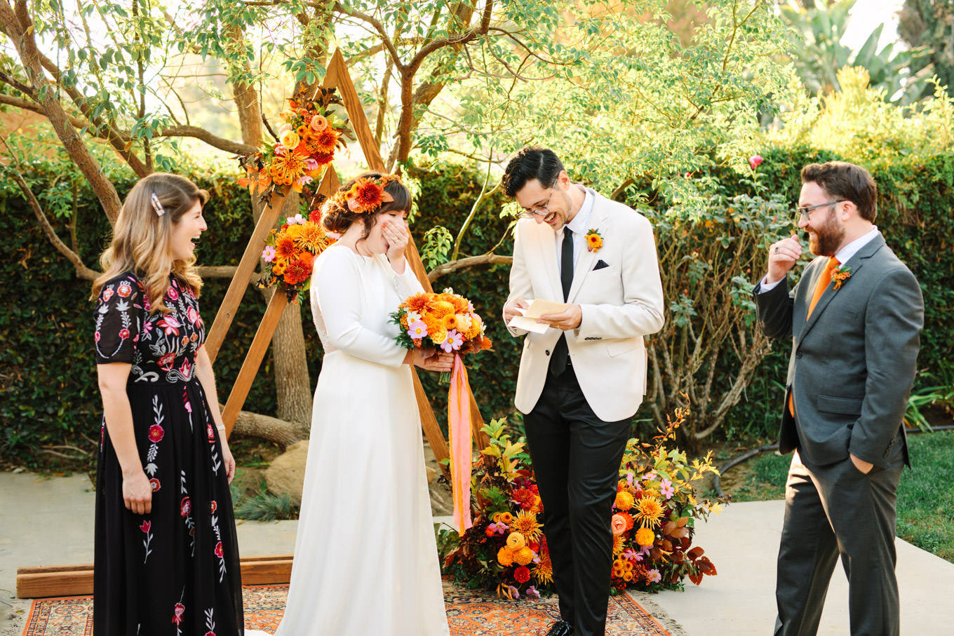 Bride and groom sharing a sweet moment at ceremony | Vibrant backyard micro wedding featured on Green Wedding Shoes | Colorful LA wedding photography | #losangeleswedding #backyardwedding #microwedding #laweddingphotographer Source: Mary Costa Photography | Los Angeles
