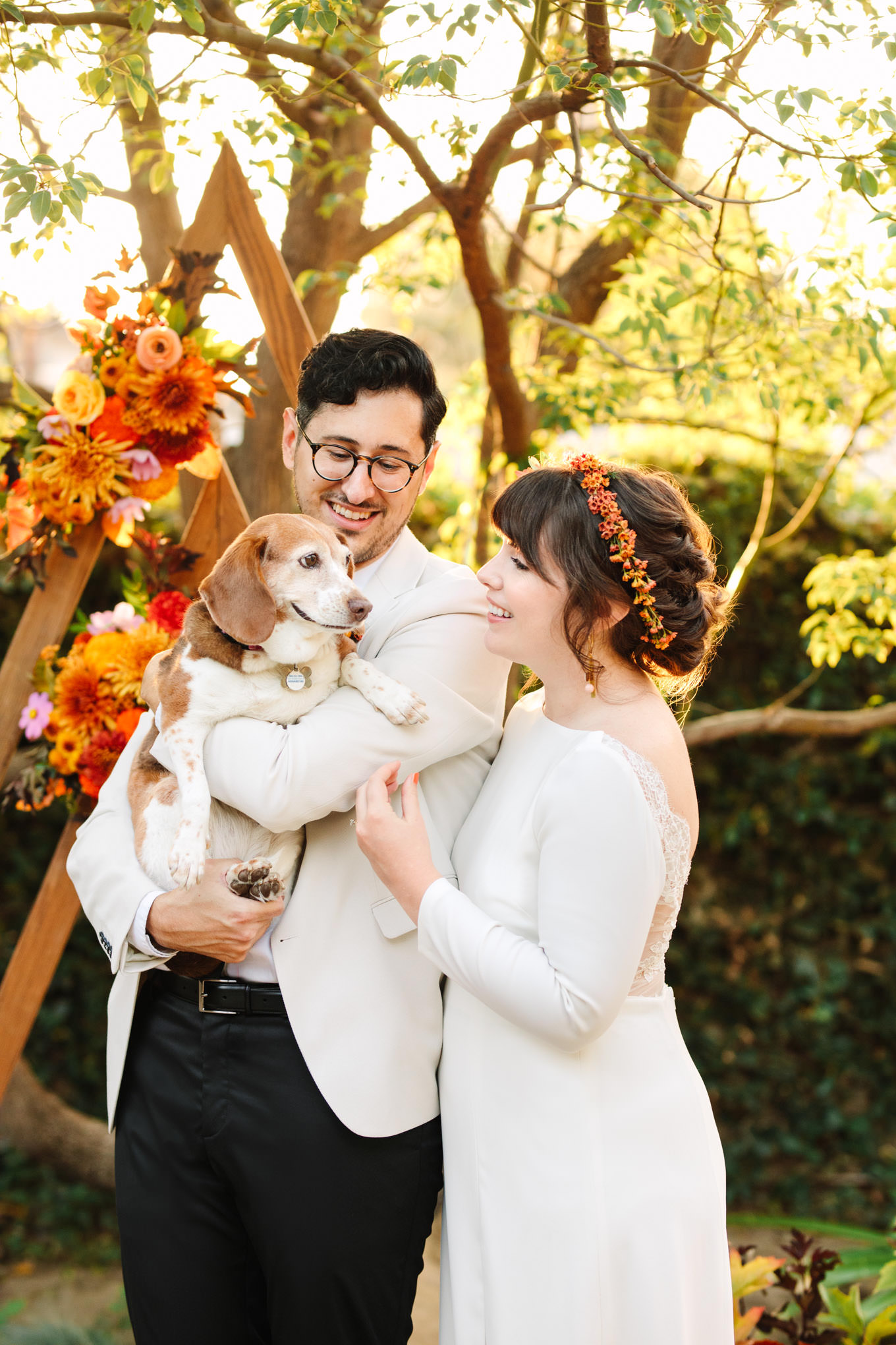 Bride and groom with their dog | Vibrant backyard micro wedding featured on Green Wedding Shoes | Colorful LA wedding photography | #losangeleswedding #backyardwedding #microwedding #laweddingphotographer Source: Mary Costa Photography | Los Angeles
