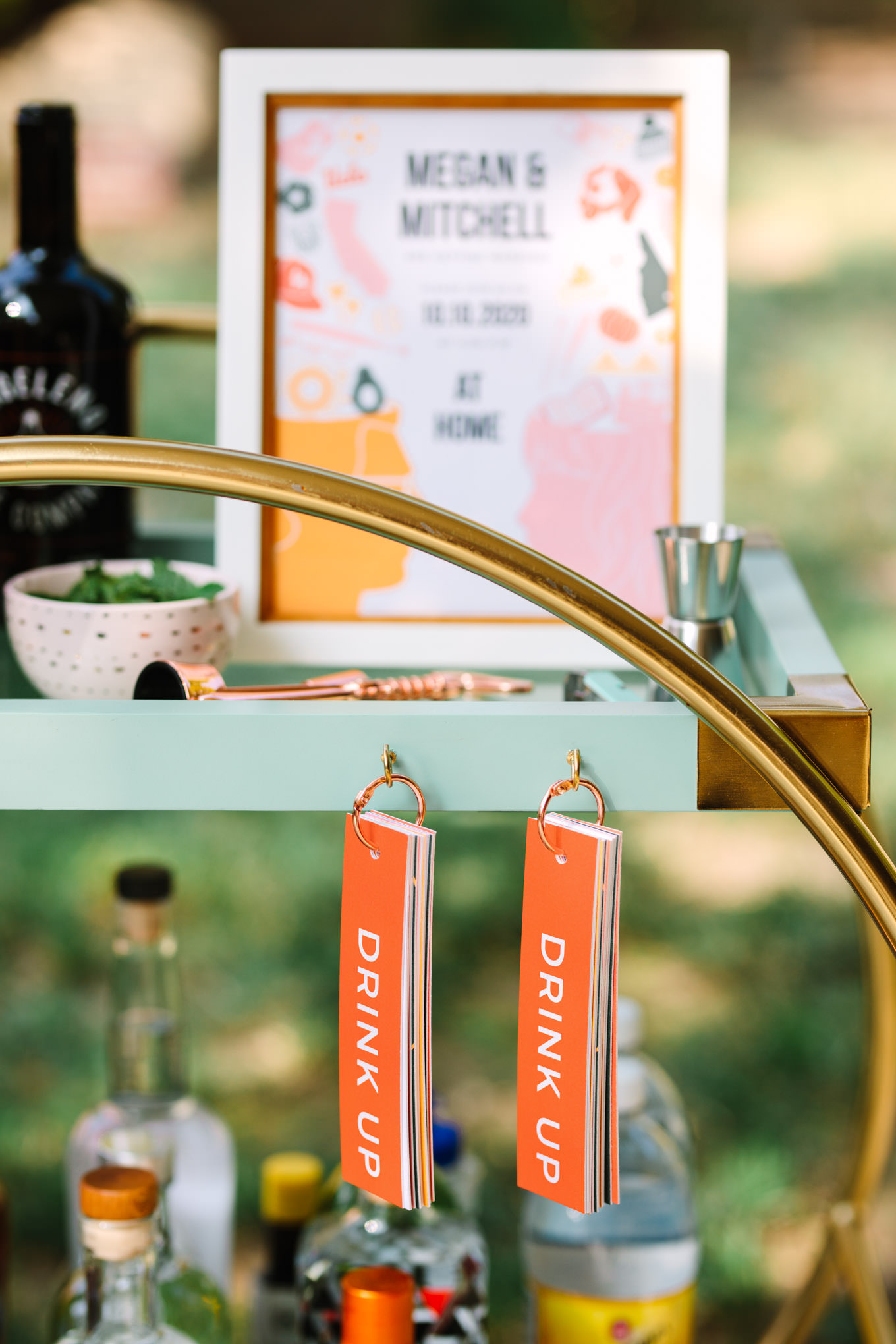Close up of unique wedding cart idea with drink menu | Vibrant backyard micro wedding featured on Green Wedding Shoes | Colorful LA wedding photography | #losangeleswedding #backyardwedding #microwedding #laweddingphotographer Source: Mary Costa Photography | Los Angeles