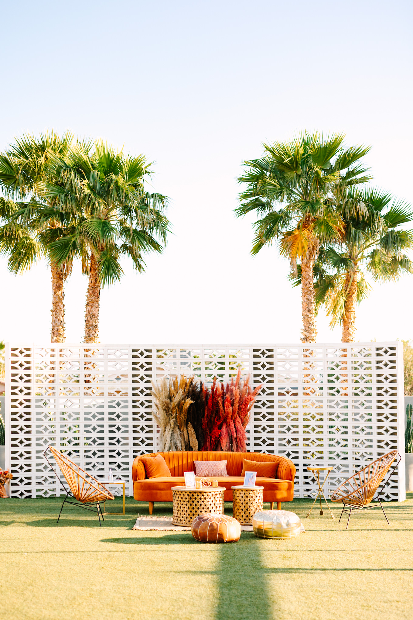 Beautiful lounge setup at Lautner Compound | Pink and orange Lautner Compound wedding | Colorful Palm Springs wedding photography | #palmspringsphotographer #palmspringswedding #lautnercompound #southerncaliforniawedding  Source: Mary Costa Photography | Los Angeles