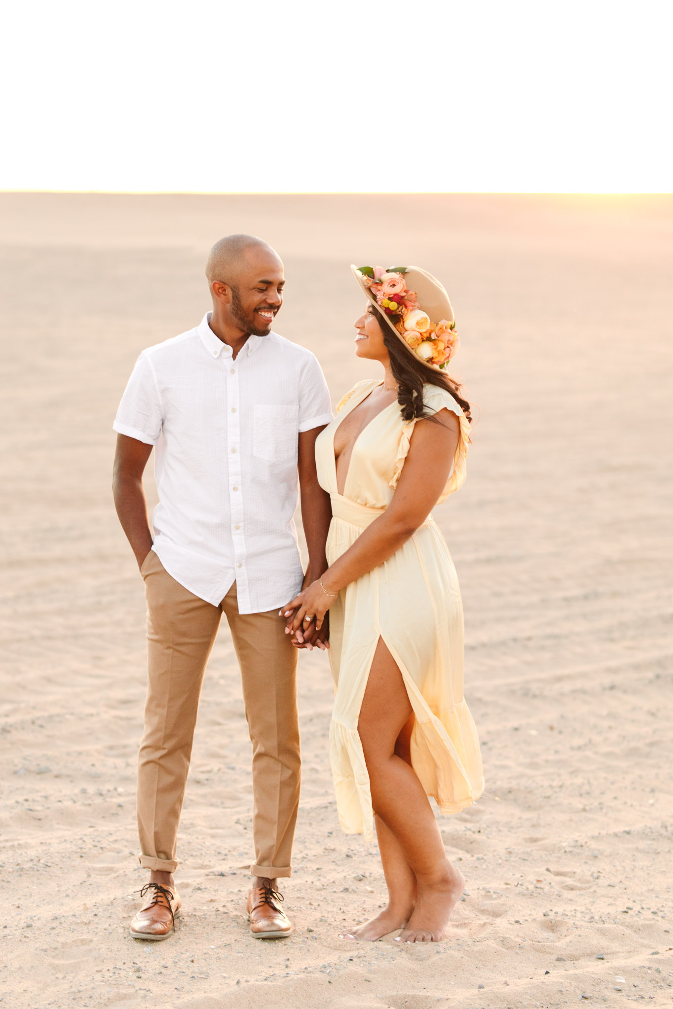 Bride to be wearing a hat at a sand dune | California Sand Dunes engagement session | Colorful Palm Springs wedding photography | #palmspringsphotographer #sanddunes #engagementsession #southerncalifornia  Source: Mary Costa Photography | Los Angeles