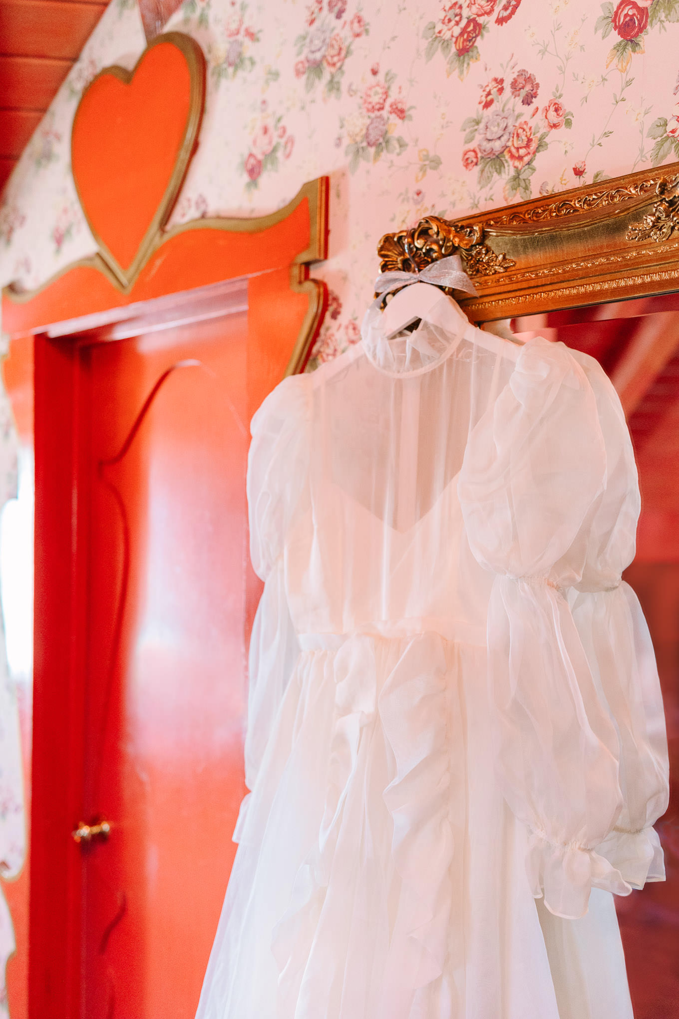 Odylyne The Ceremony gown hanging in Madonna Inn | Colorful and quirky wedding at Higuera Ranch in San Luis Obispo | #sanluisobispowedding #californiawedding #higueraranch #madonnainn   
Source: Mary Costa Photography | Los Angeles 