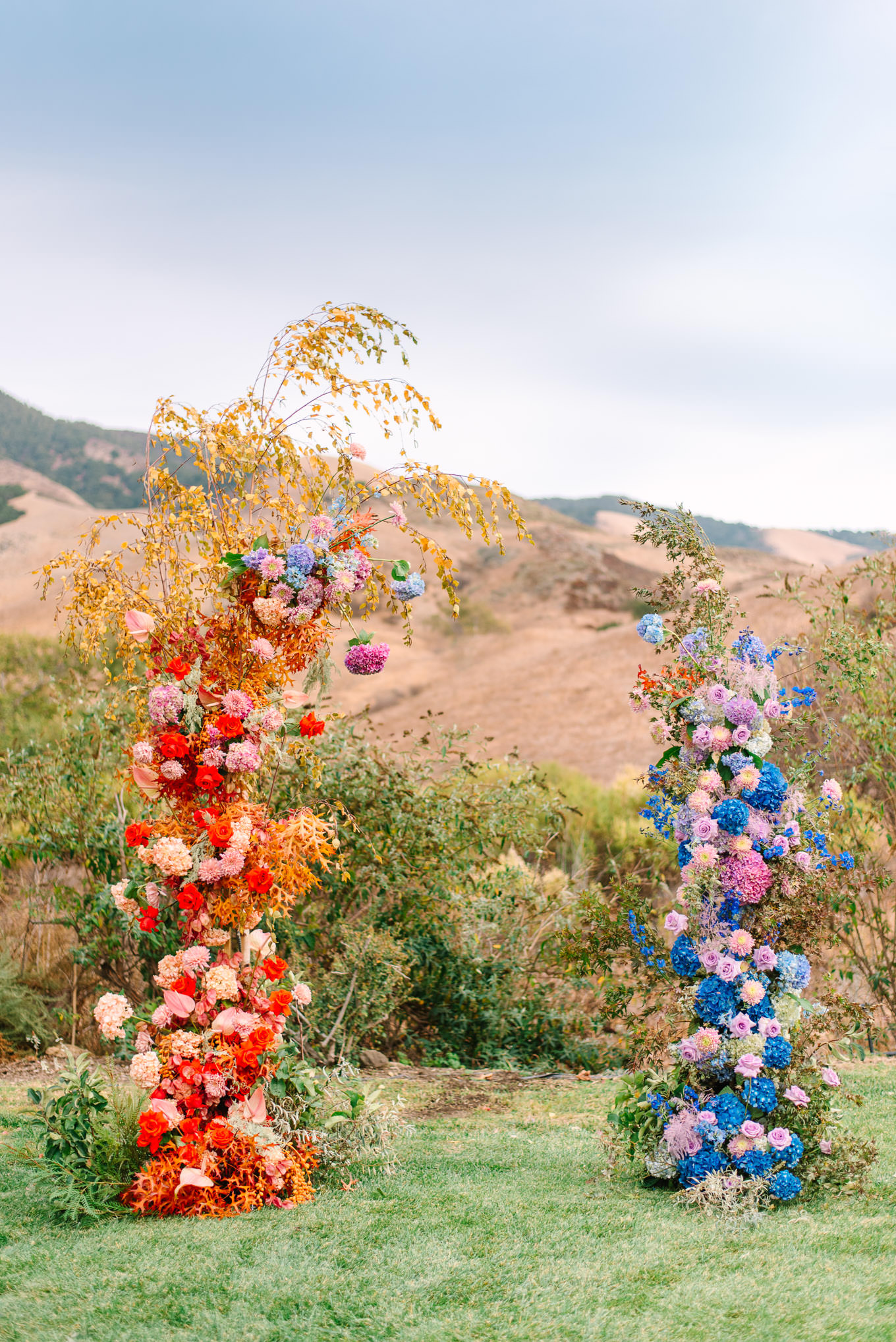 Colorful floral arches for wedding ceremony | Colorful and quirky wedding at Higuera Ranch in San Luis Obispo | #sanluisobispowedding #californiawedding #higueraranch #madonnainn   Source: Mary Costa Photography | Los Angeles