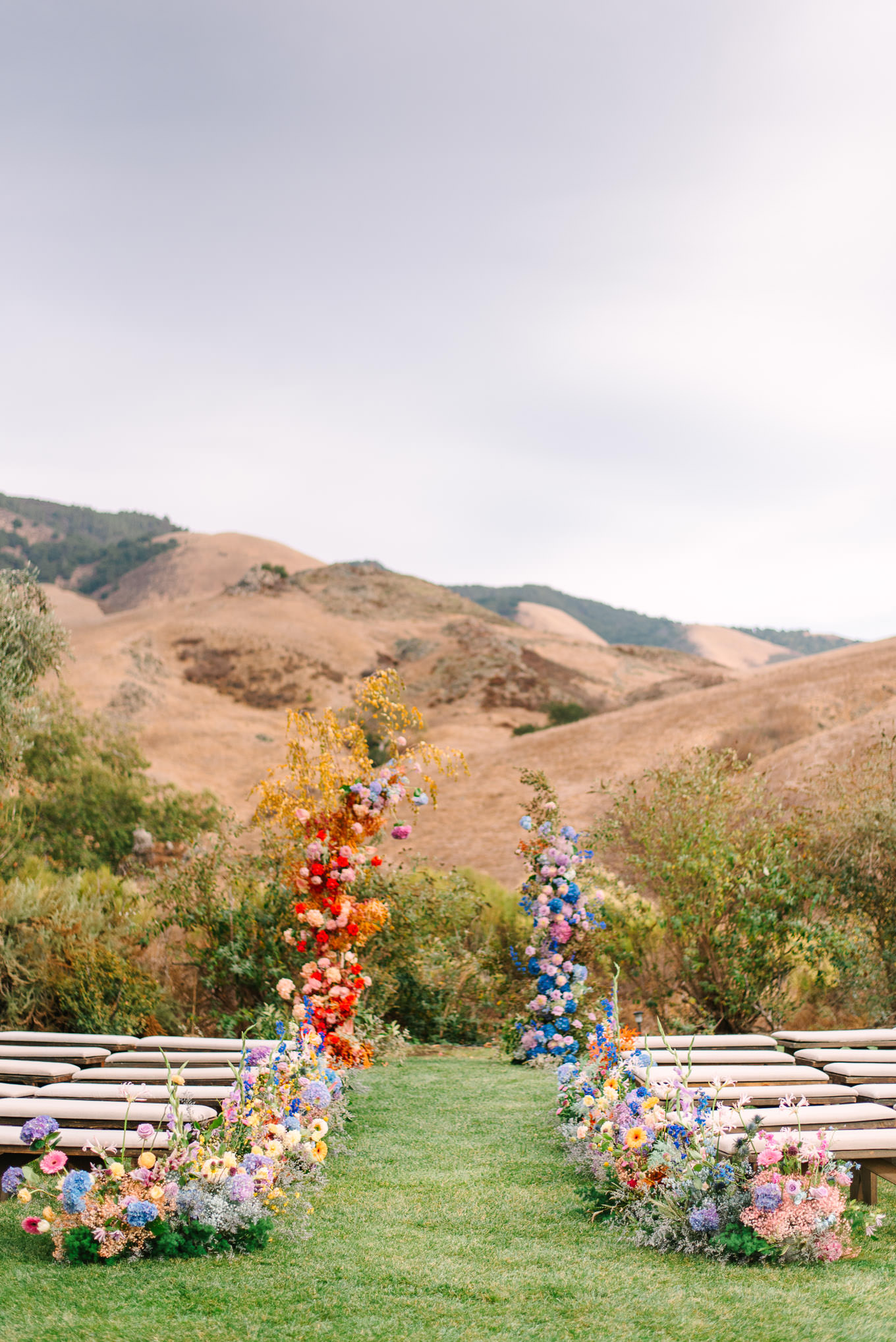 Floral filled wedding ceremony | Colorful and quirky wedding at Higuera Ranch in San Luis Obispo | #sanluisobispowedding #californiawedding #higueraranch #madonnainn   Source: Mary Costa Photography | Los Angeles