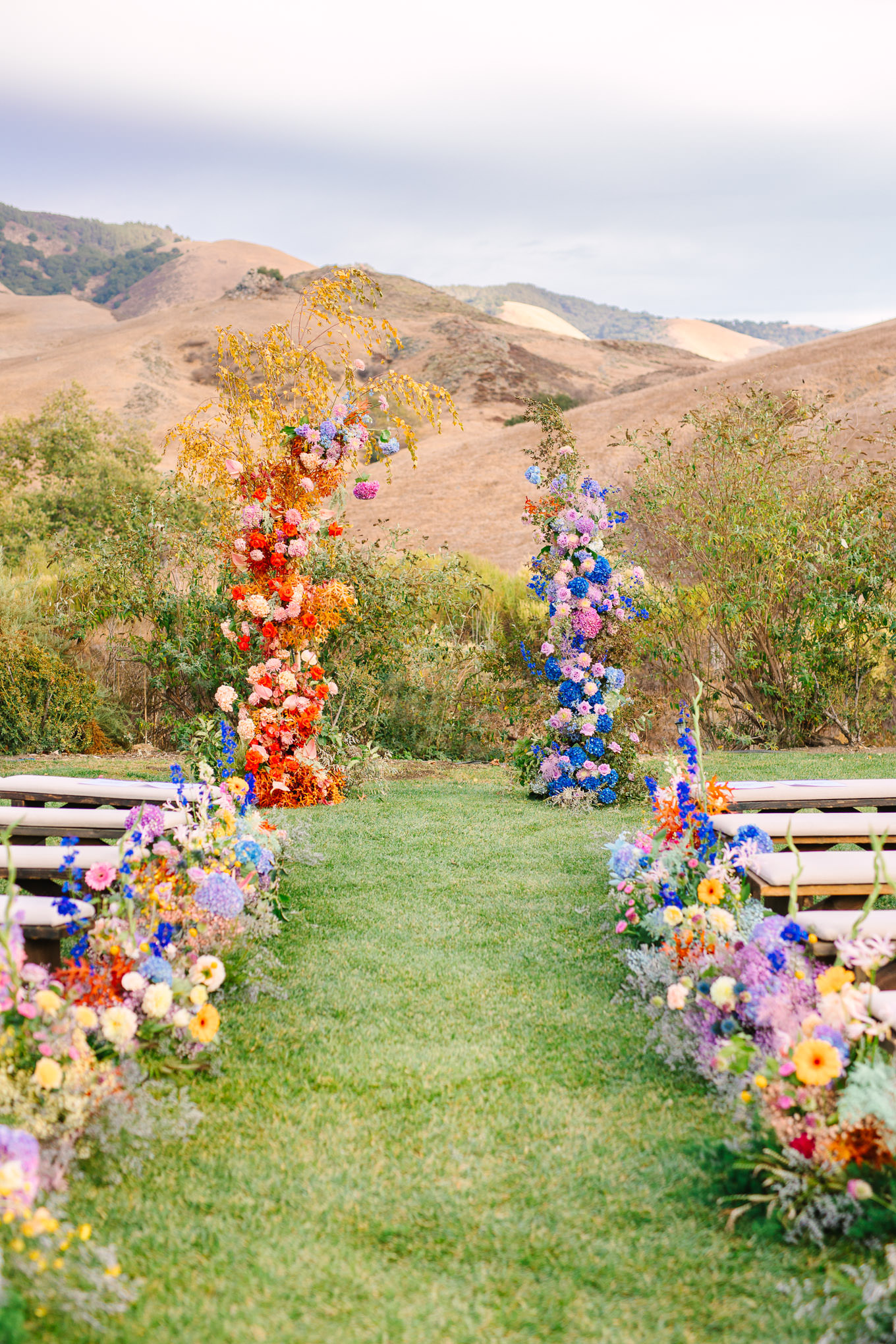 Floral wedding ceremony installation | Colorful and quirky wedding at Higuera Ranch in San Luis Obispo | #sanluisobispowedding #californiawedding #higueraranch #madonnainn   
Source: Mary Costa Photography | Los Angeles
