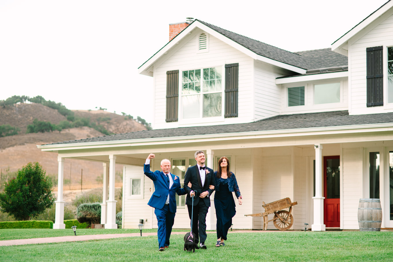 Groom walking with parents at wedding ceremony | Colorful and quirky wedding at Higuera Ranch in San Luis Obispo | #sanluisobispowedding #californiawedding #higueraranch #madonnainn   
Source: Mary Costa Photography | Los Angeles