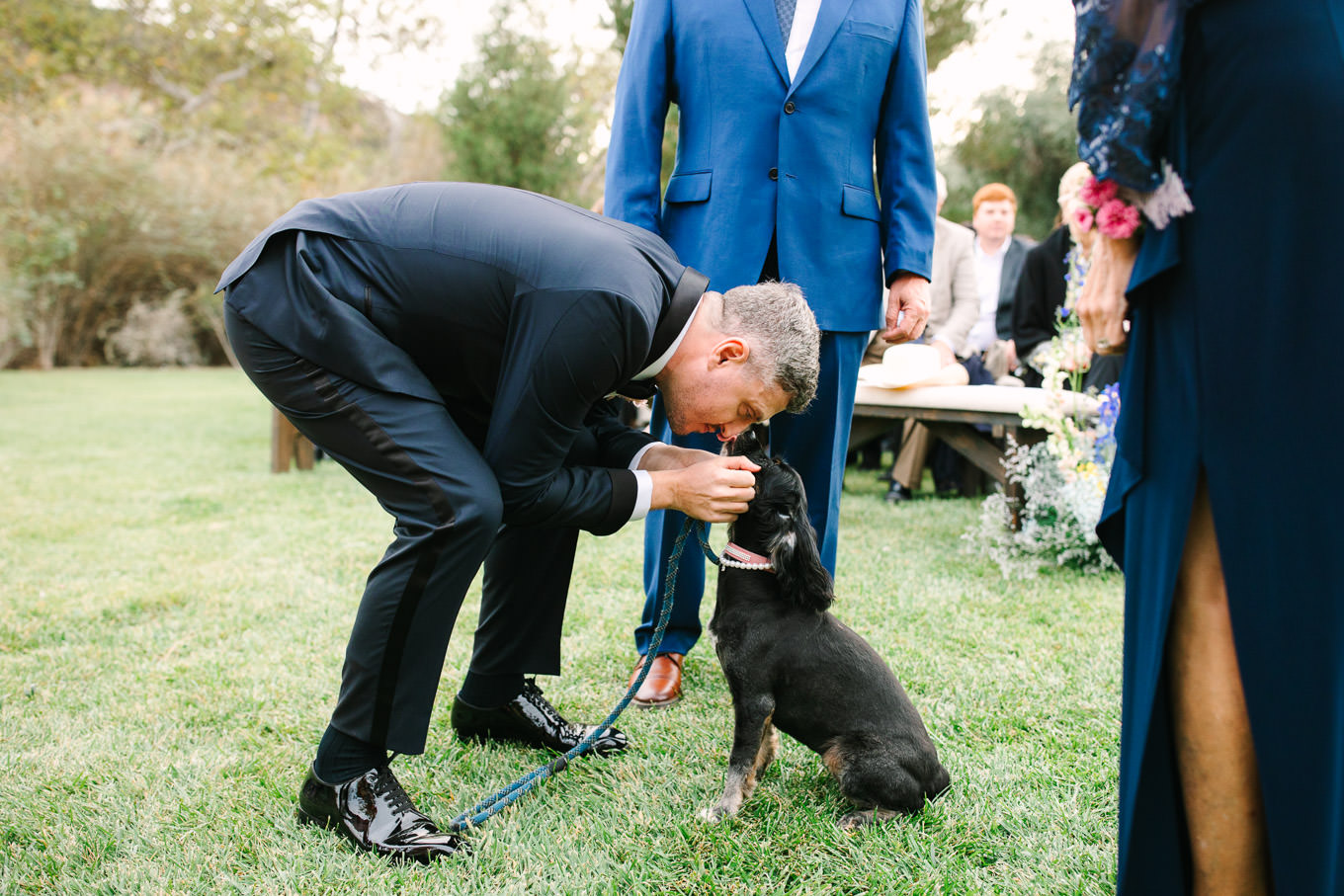 Groom with his dog at wedding ceremony | Colorful and quirky wedding at Higuera Ranch in San Luis Obispo | #sanluisobispowedding #californiawedding #higueraranch #madonnainn   
Source: Mary Costa Photography | Los Angeles